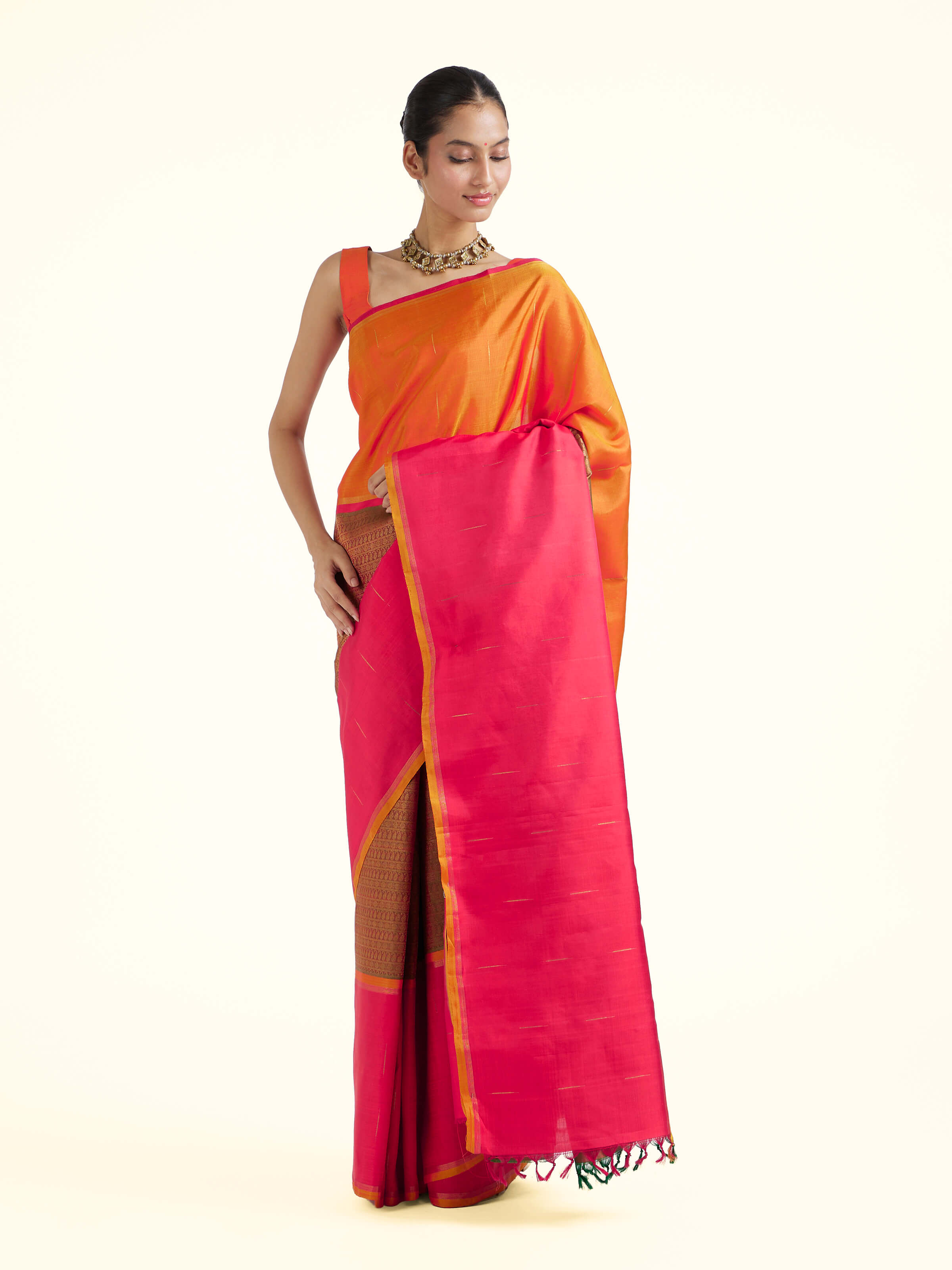 Side view of red silk Kancheepuram saree showcasing silk sheen