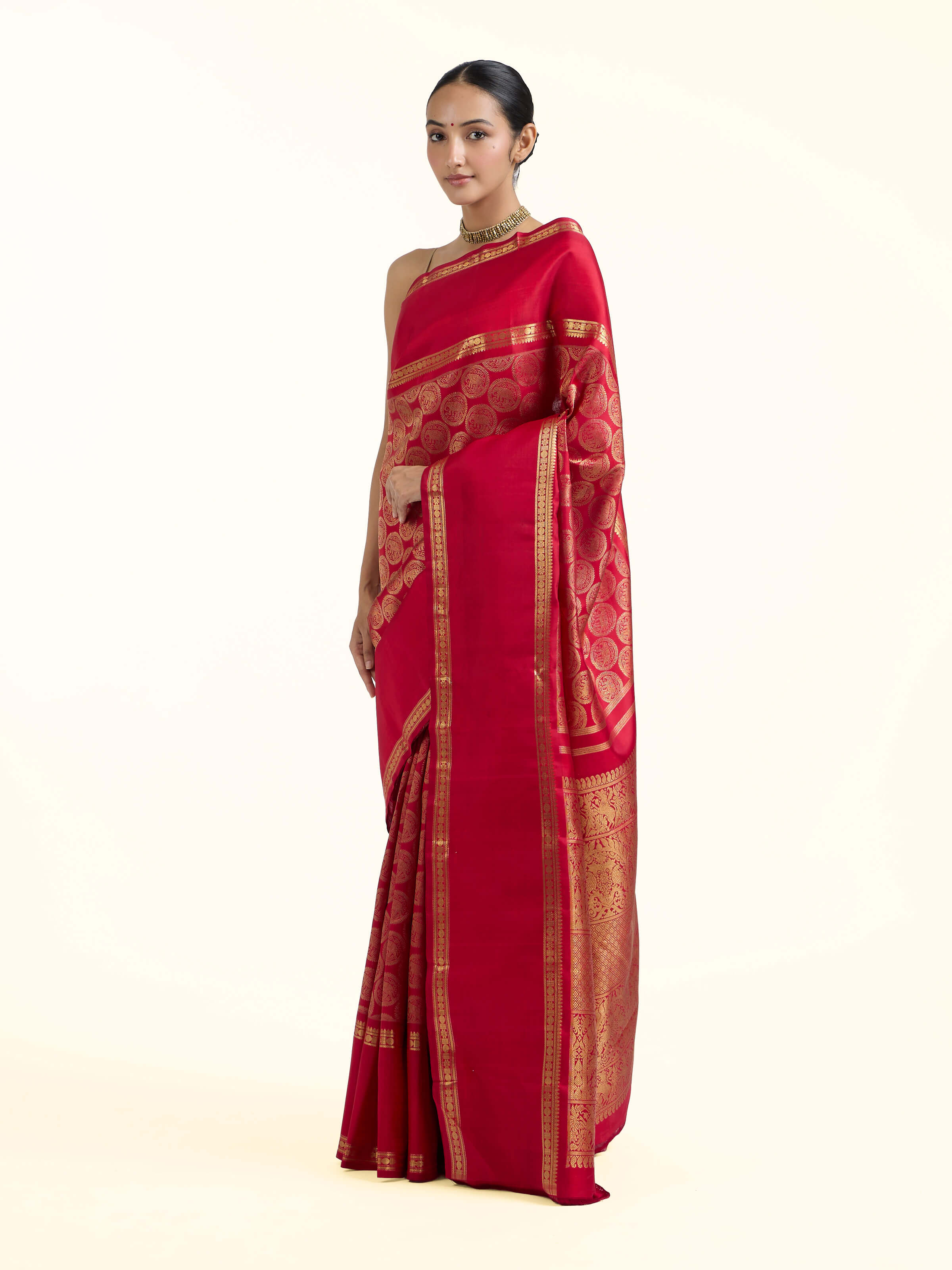 Side view of red silk Kancheepuram saree with elegant drape and traditional border
