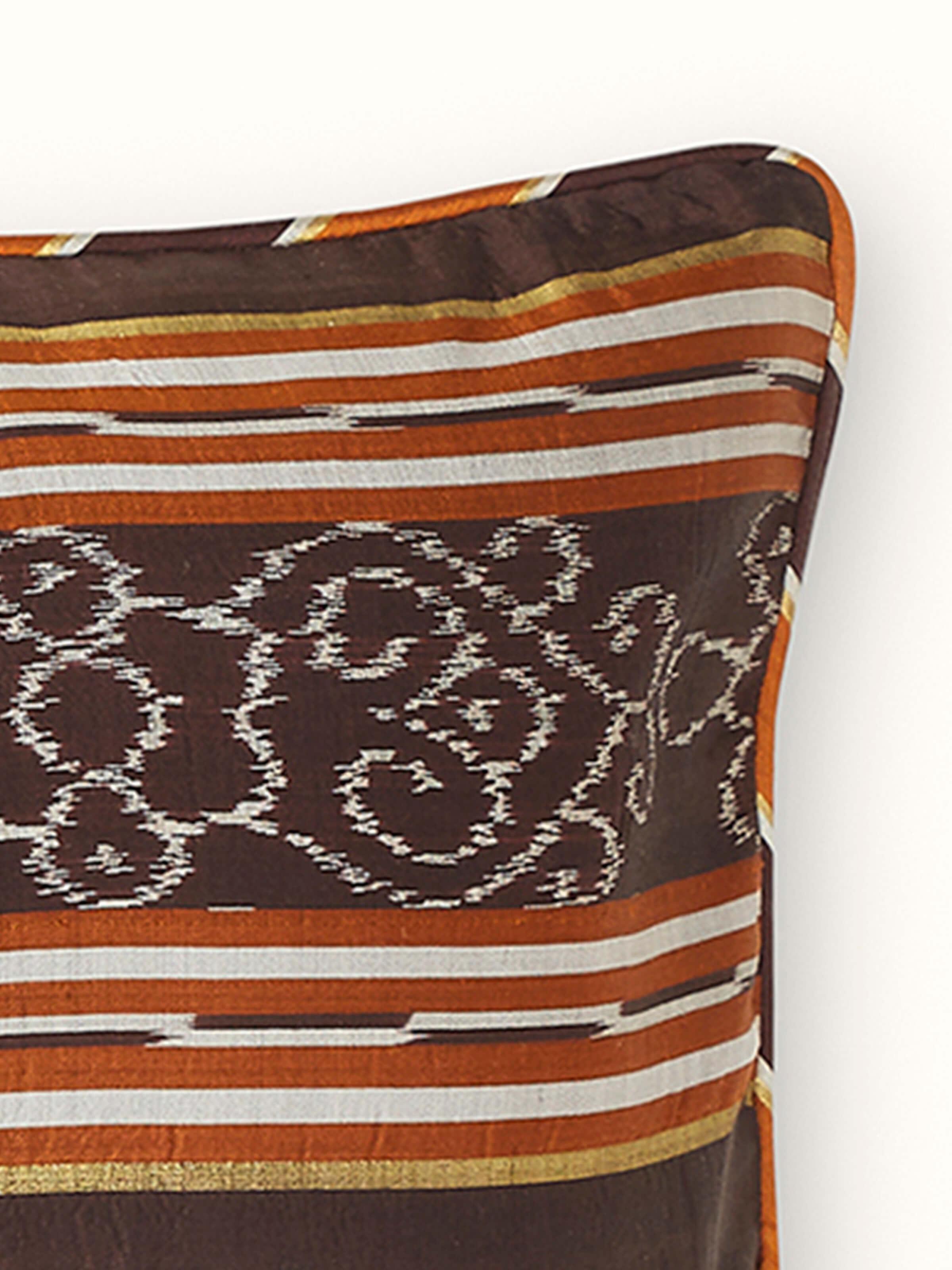 Front view displaying the coffee stripe pattern on the silk Odisha handloom Ikat lumbar cushion cover