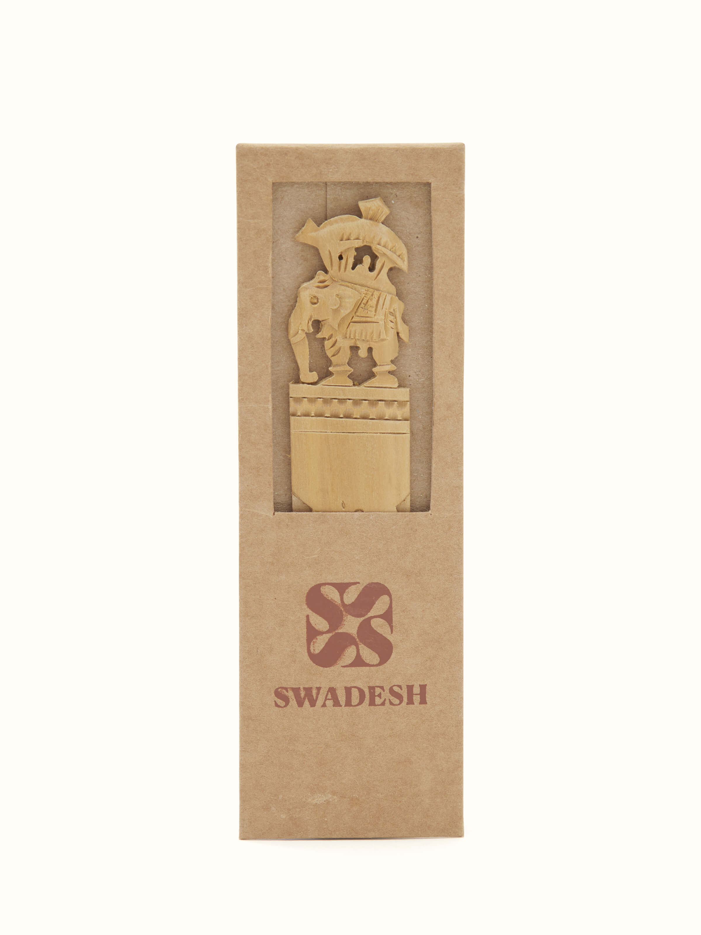 Detailed view of Carved Sandalwood Elephant Bookmark by Swadesh highlighting the fine craftsmanship and rich texture of the sandalwood.