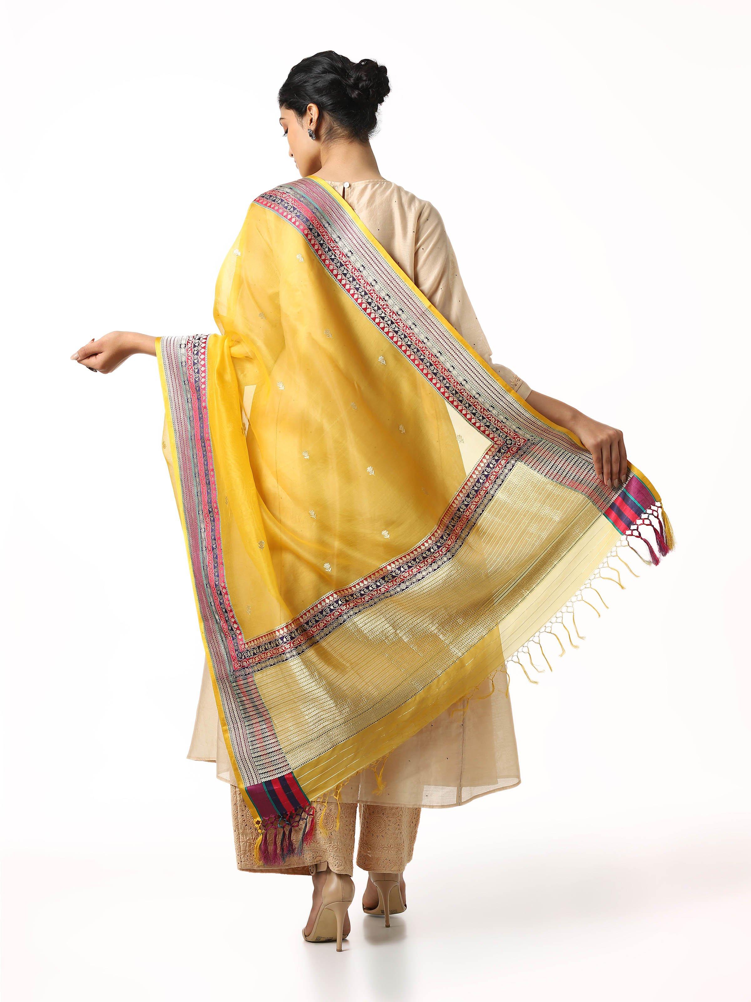 Detailed texture and zari border of yellow Banarasi silk dupatta