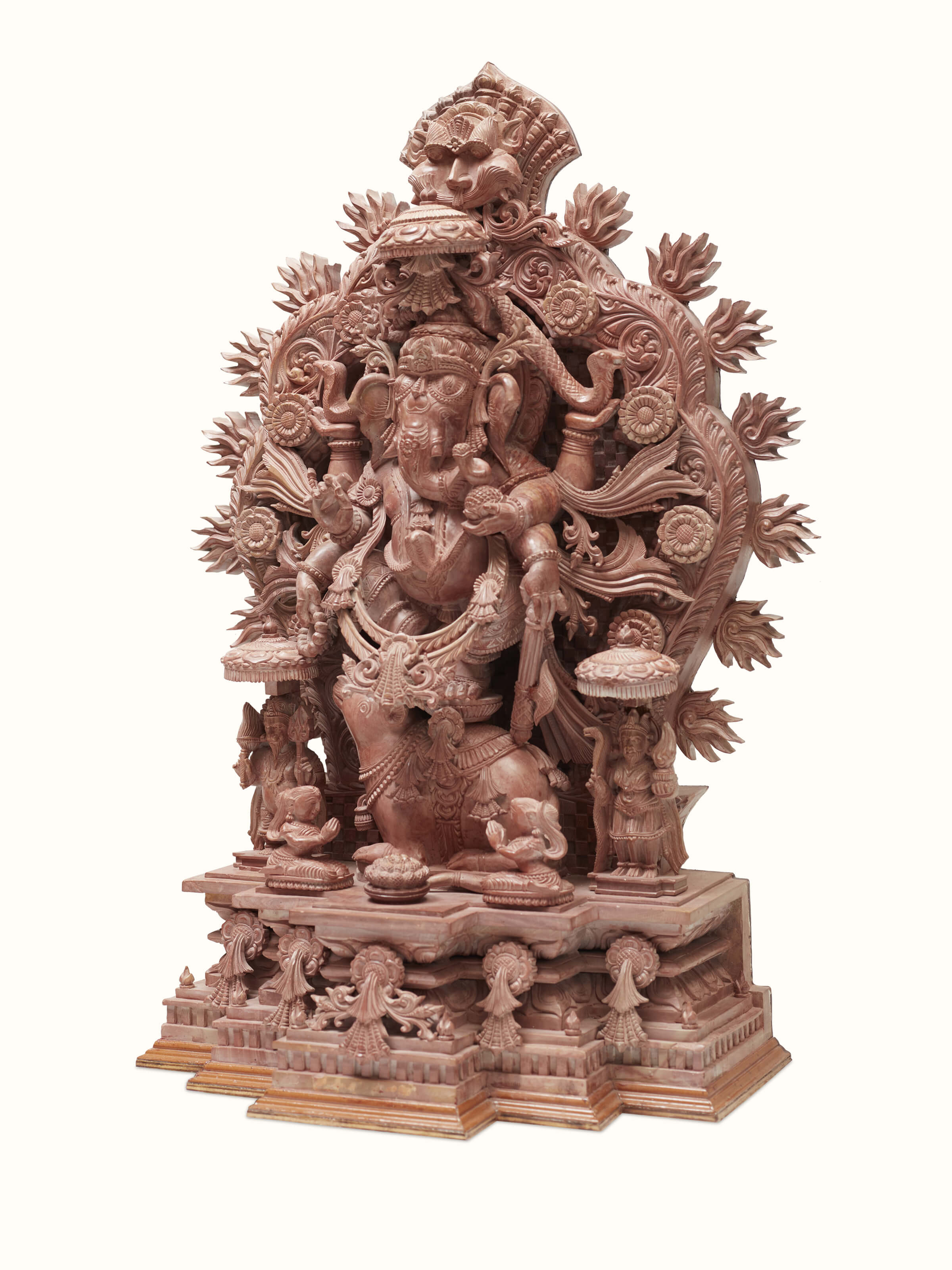 Close-up view of carved stone Vinayaka idol, emphasizing the fine details.