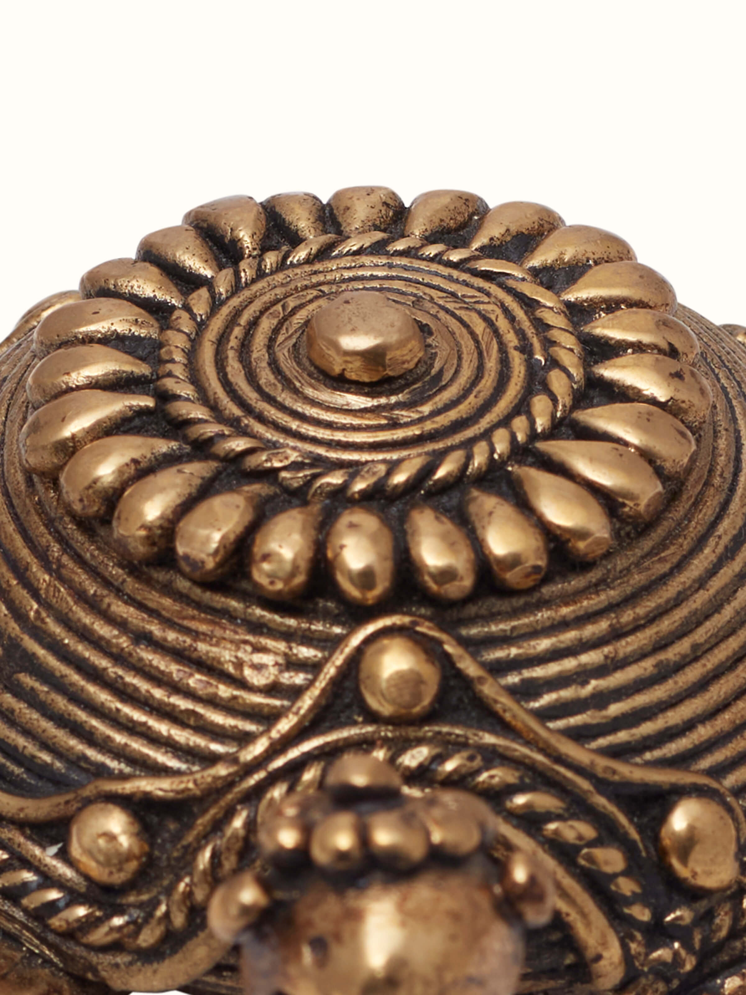 Detail shot of dhokra tortoise brass figurine showing metal texture