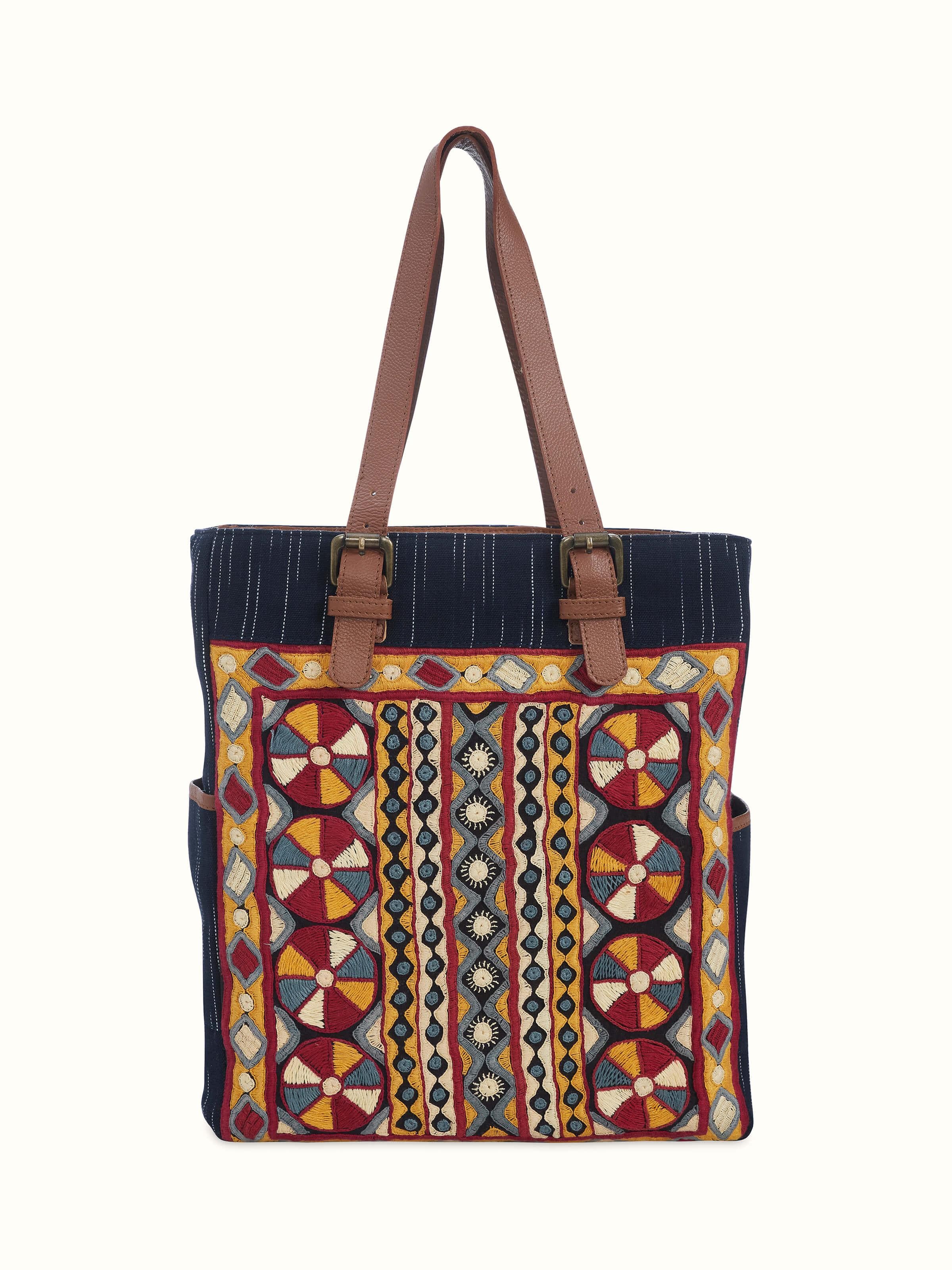 Front view of Grey Leather & Textile Embroidered Tote Bag featuring intricate embroidery and sturdy leather.