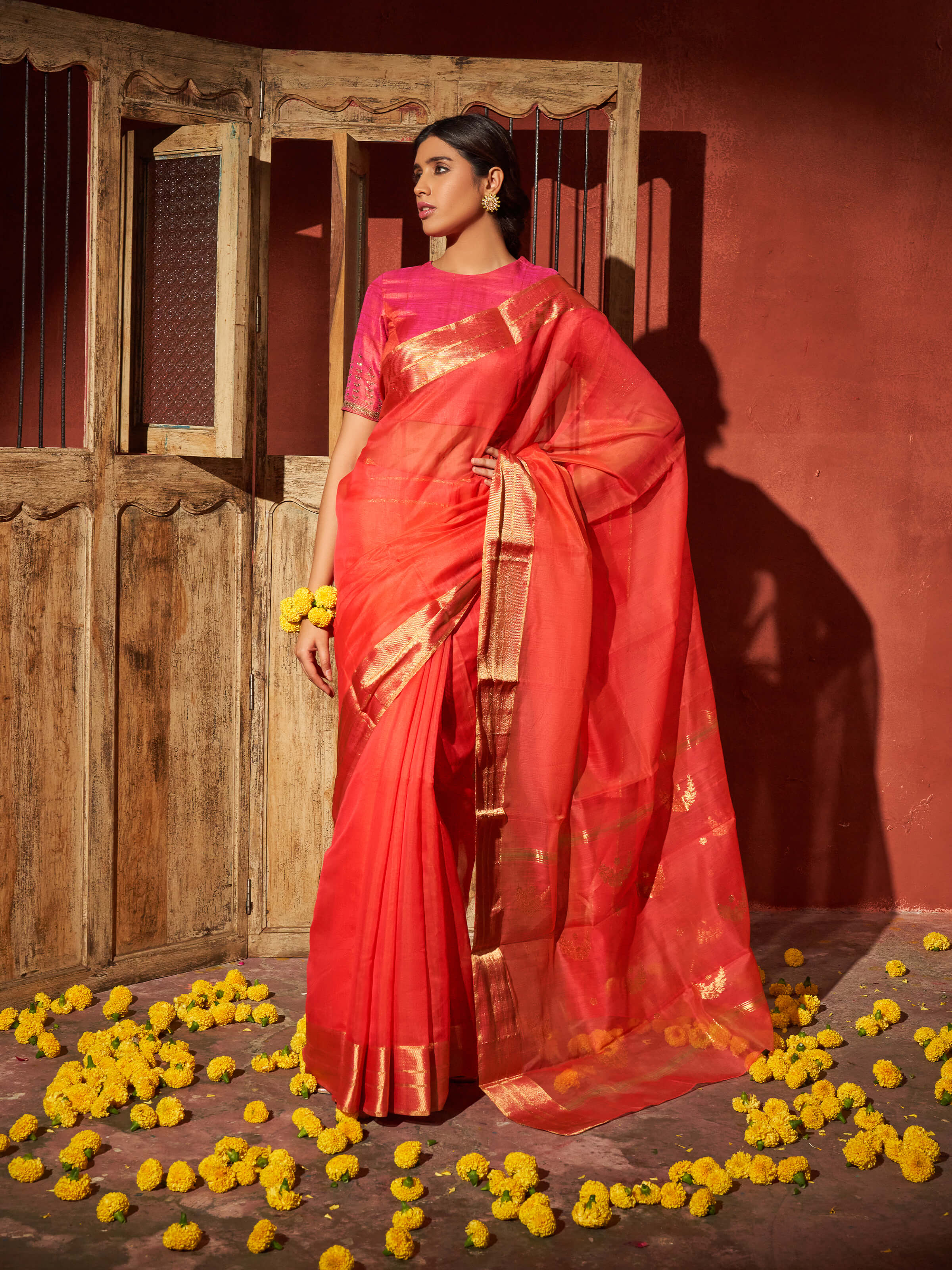 Side view of coral mulberry silk Chanderi saree showcasing lightweight texture