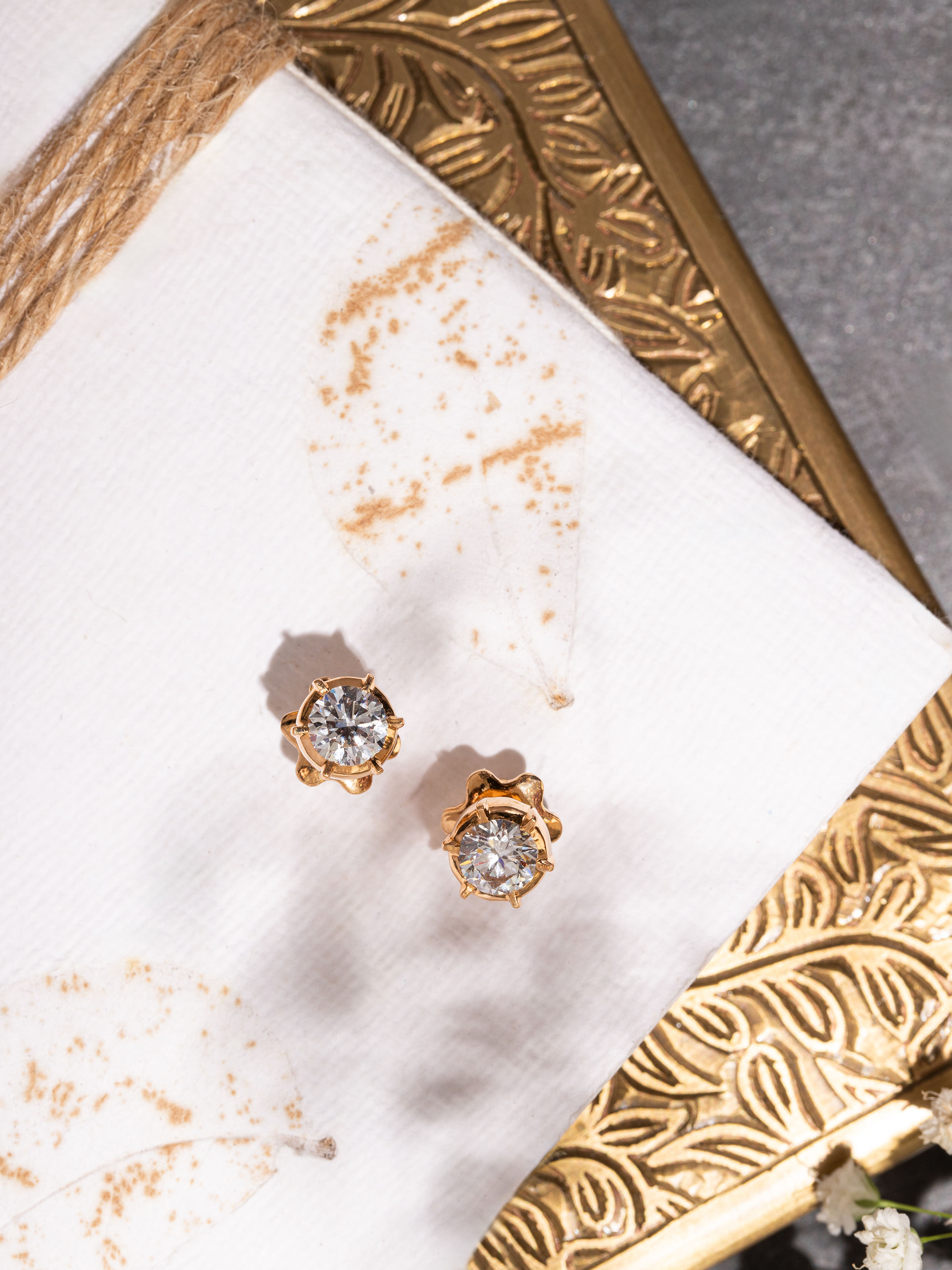 Side view capturing the elegant setting and classic shape of the gold studs