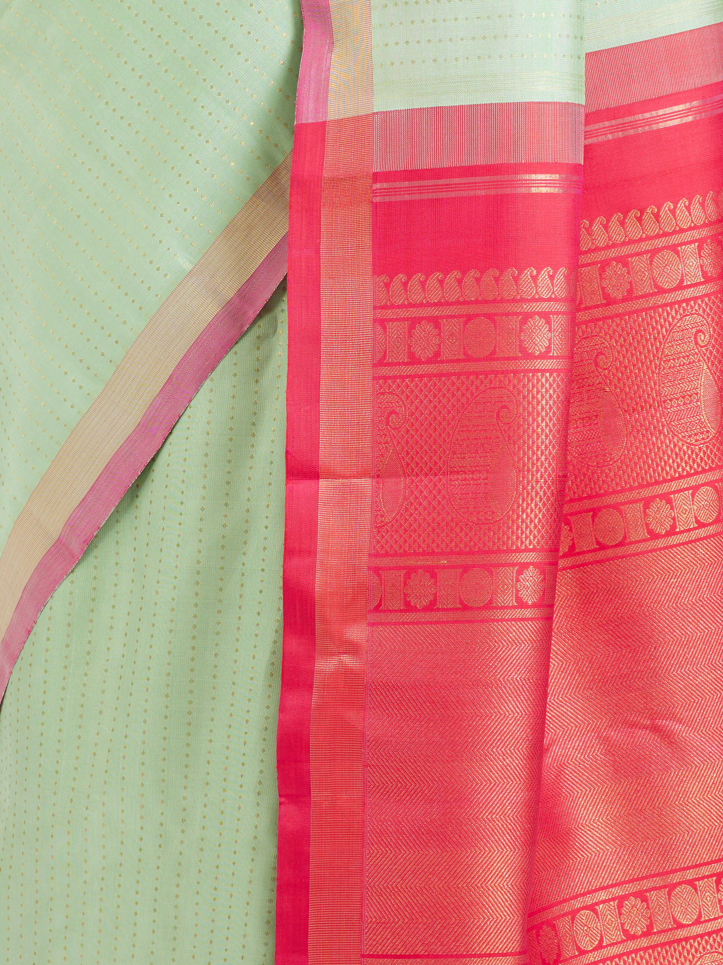 Detail view of light green silk Kancheepuram saree showing silk texture and zari work