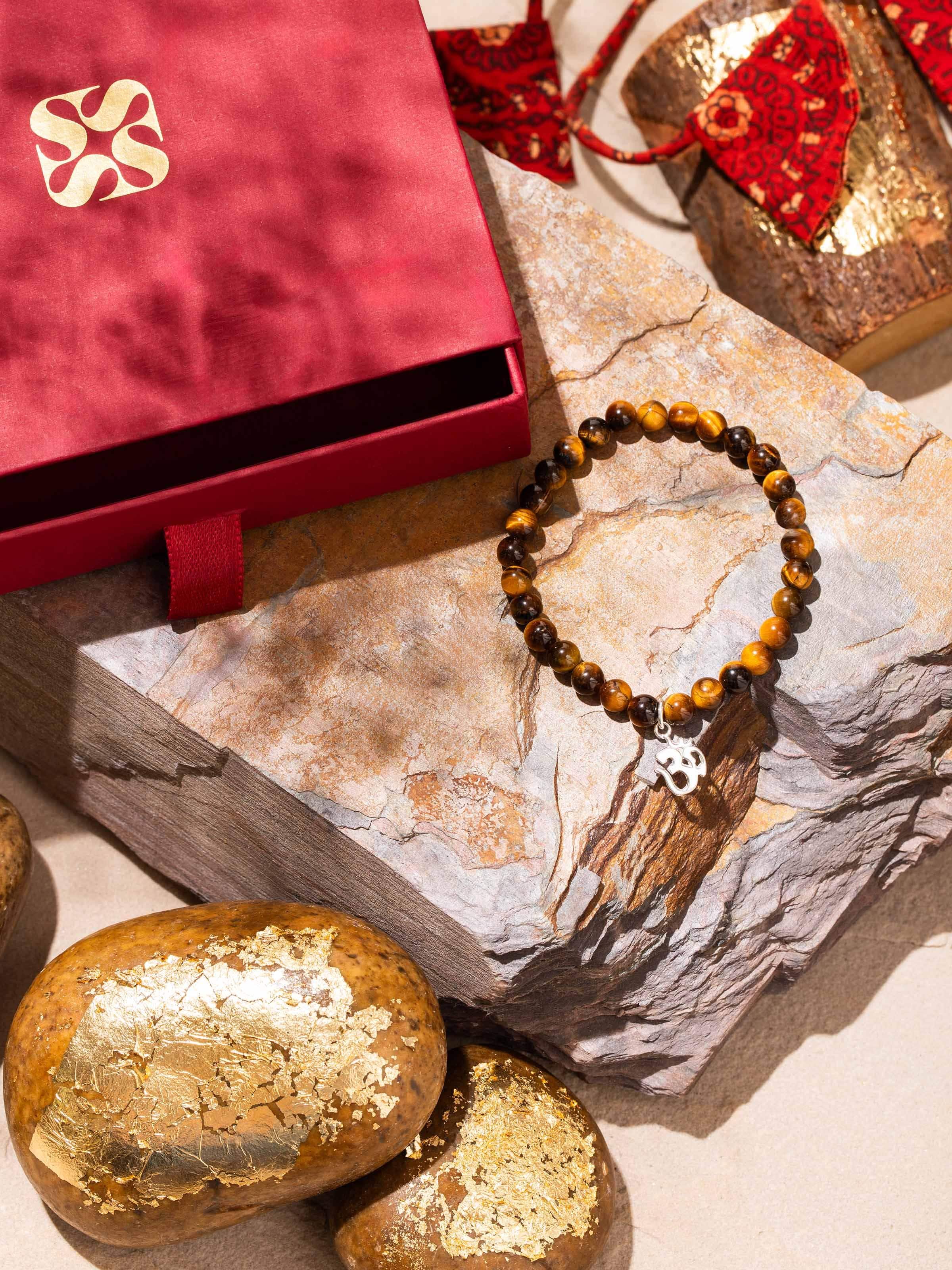 Lifestyle view of Tiger Eye & Black Onyx gemstone bracelet worn on wrist with casual outfit