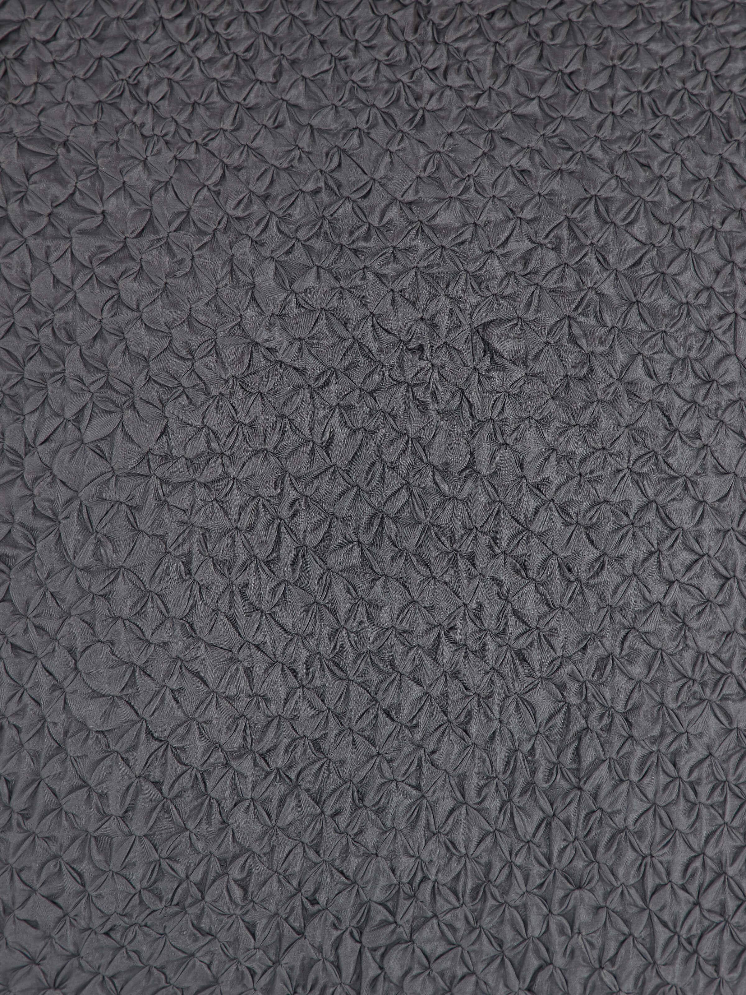 Artistic side close-up capturing the texture variations and subtle sheen of the silk material