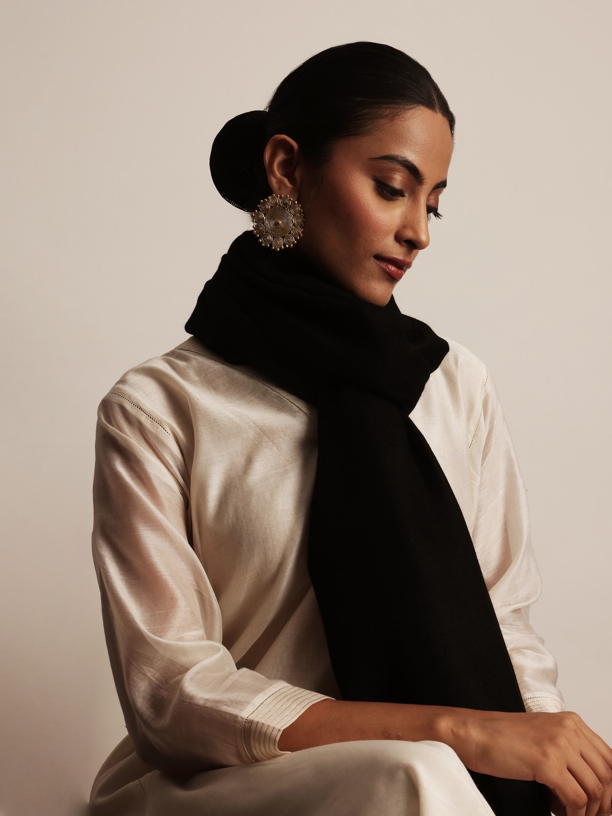 Side view of black pashmina kaaj embroidered handwoven stole showcasing drape