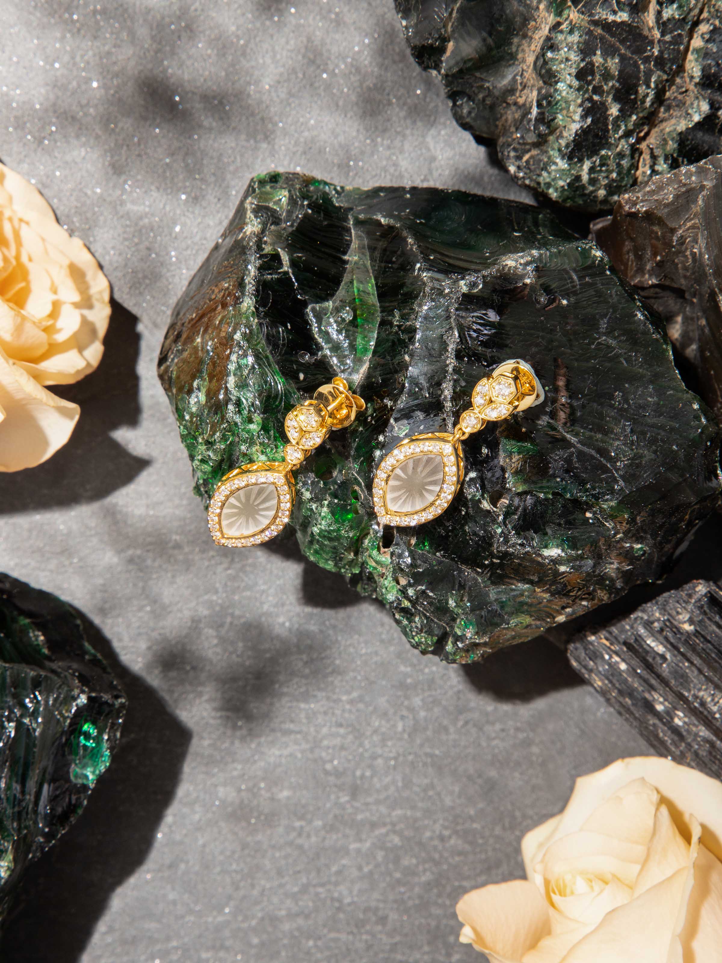 Lifestyle view of lapidary 14 karat gold drop earrings