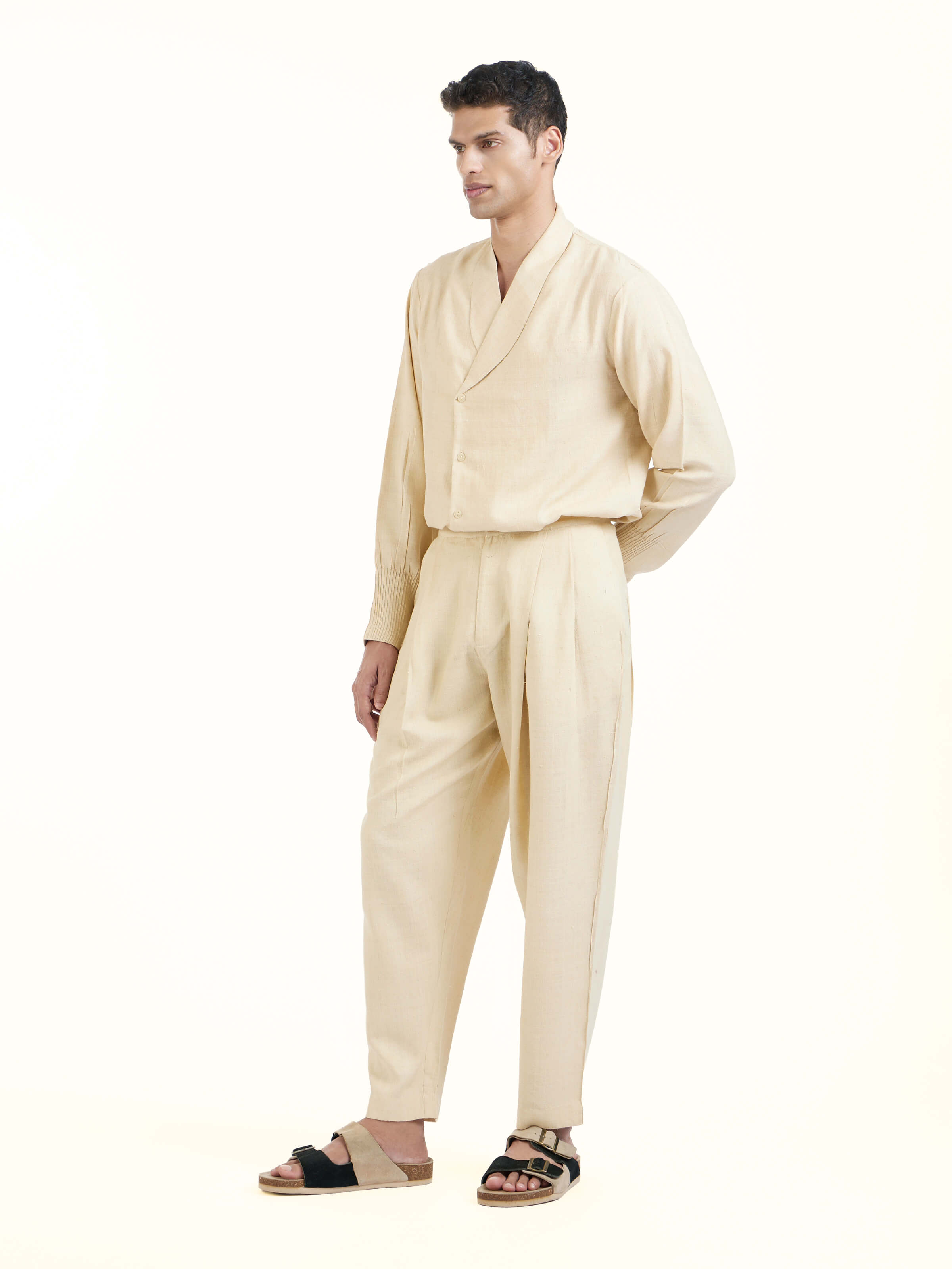 Side view of off-white silk handloom straight pants showcasing tailored fit