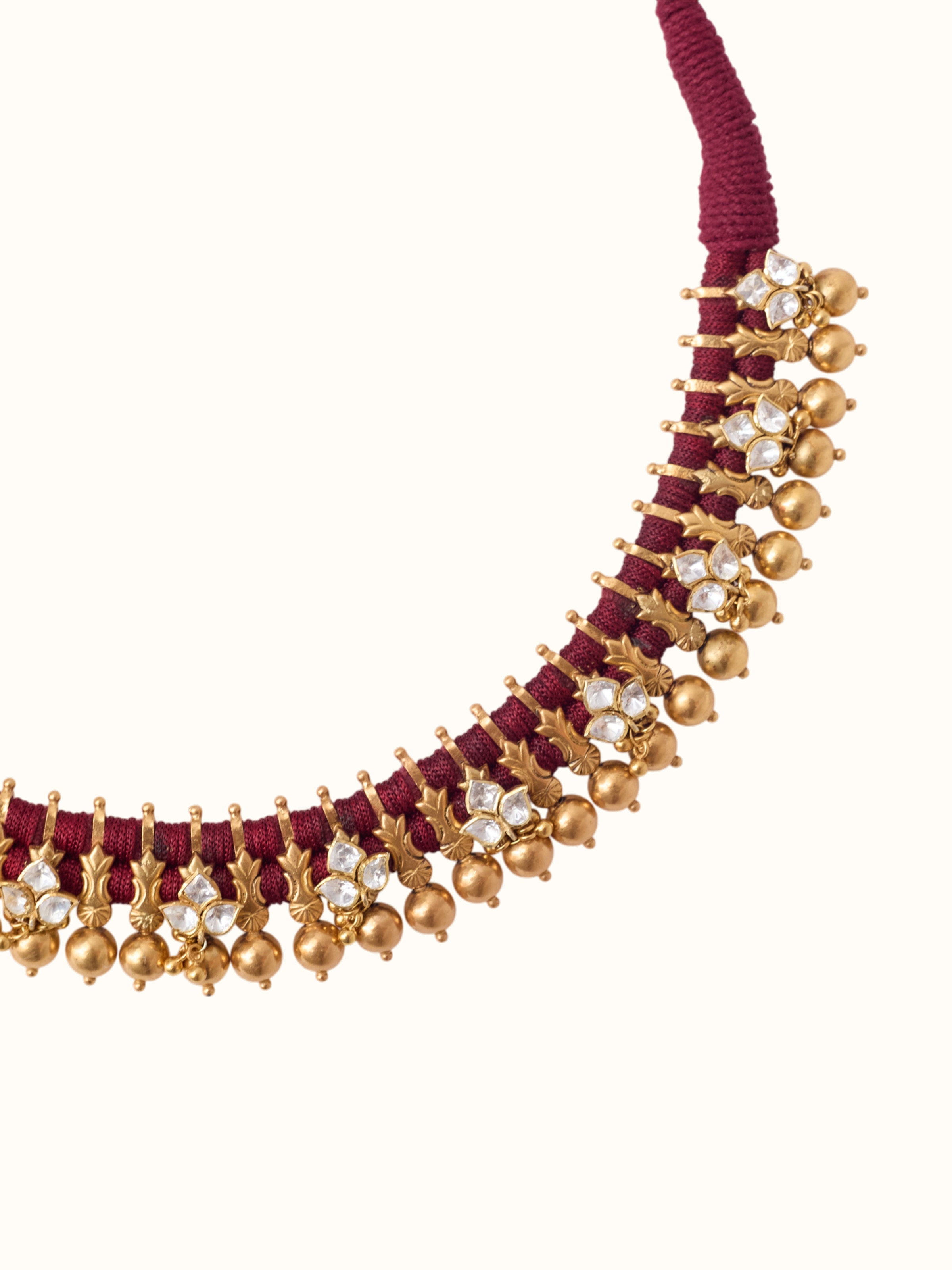 detail view of silver smithing gold plated collar necklace texture