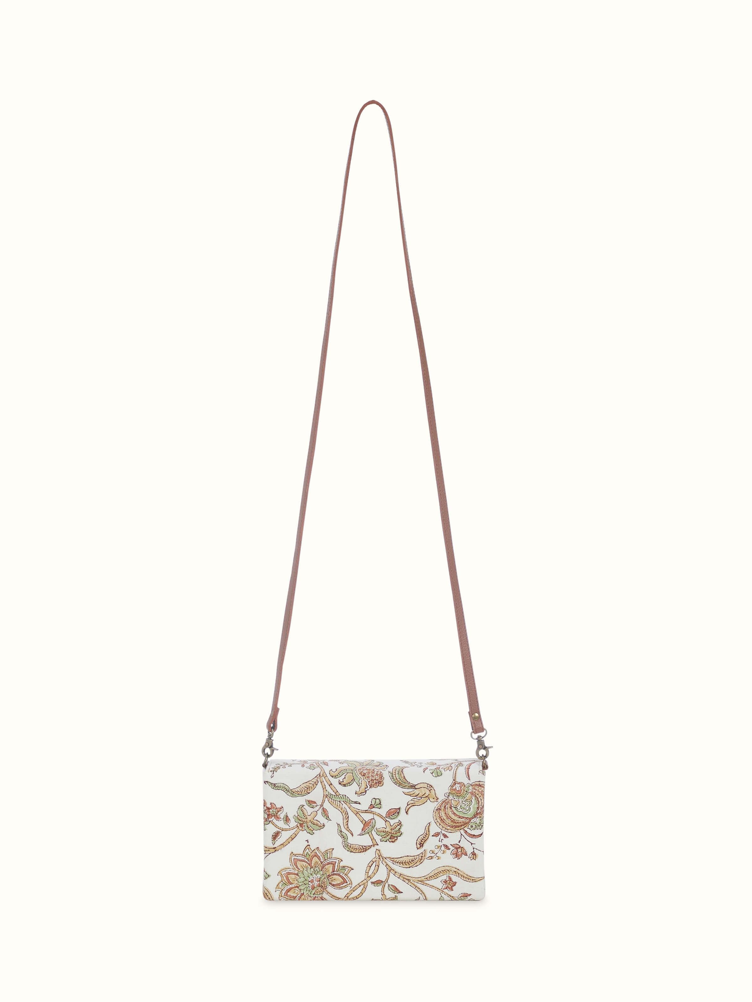 Front view of mustard leather and textile hand block printed sling bag showing intricate print and leather details