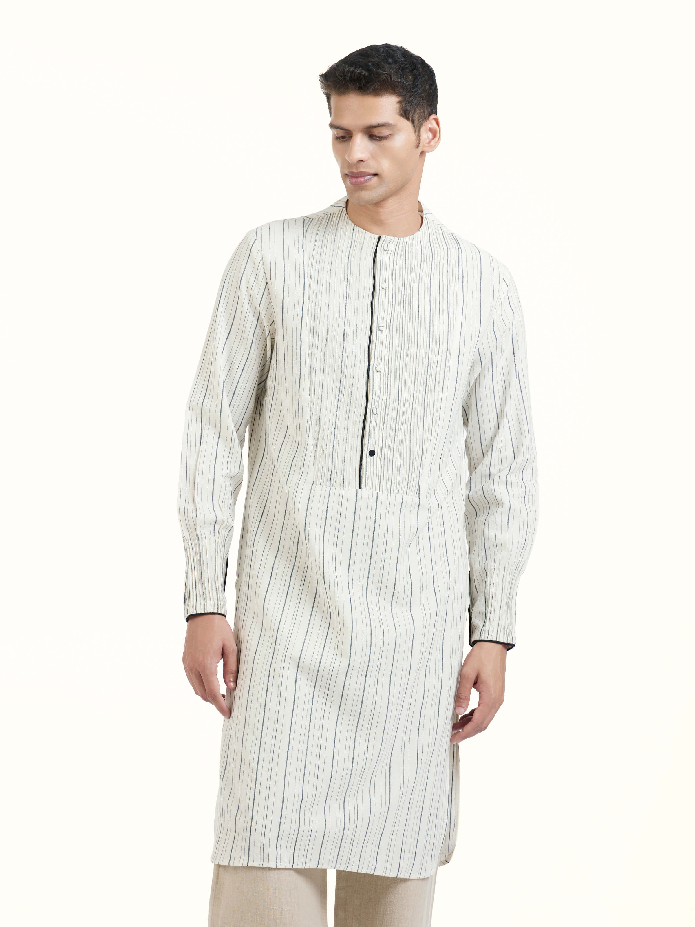 Angled view of ivory silk handloom kurta highlighting fabric sheen