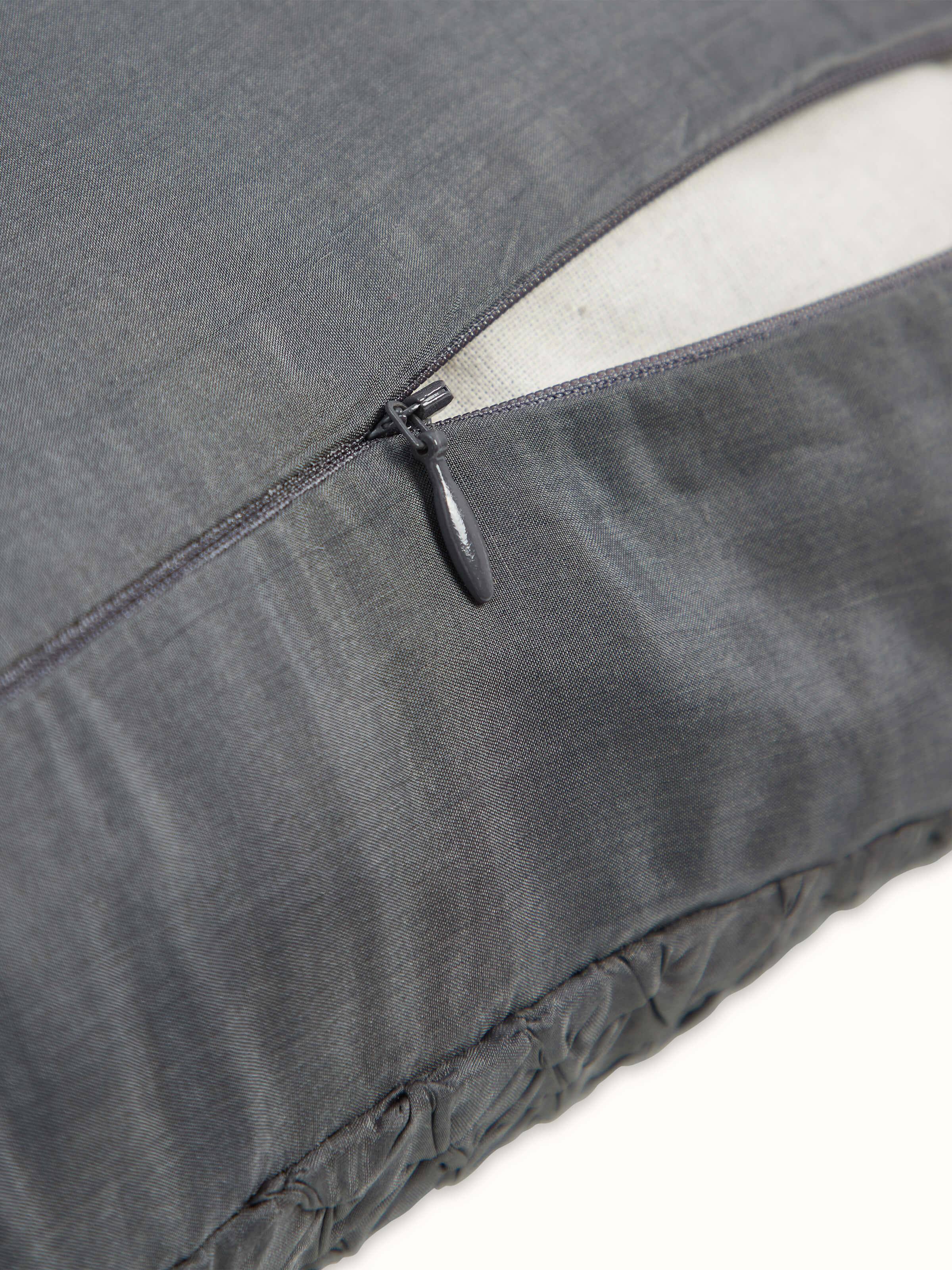 Angled shot emphasizing the intricate tie & dye design and fine silk weave