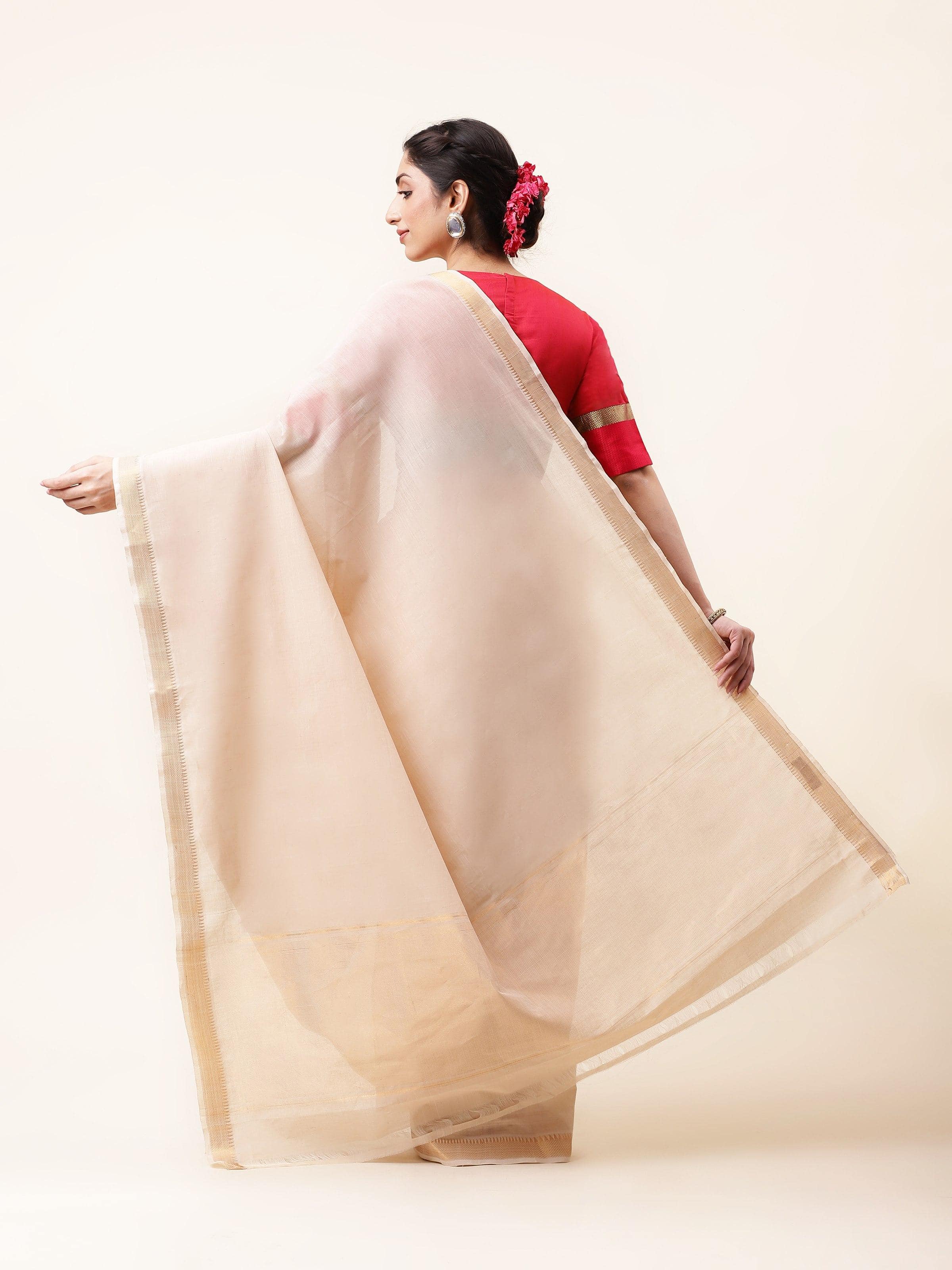 Back view of off-white Mangalgiri saree showcasing fluid drape and neat finish