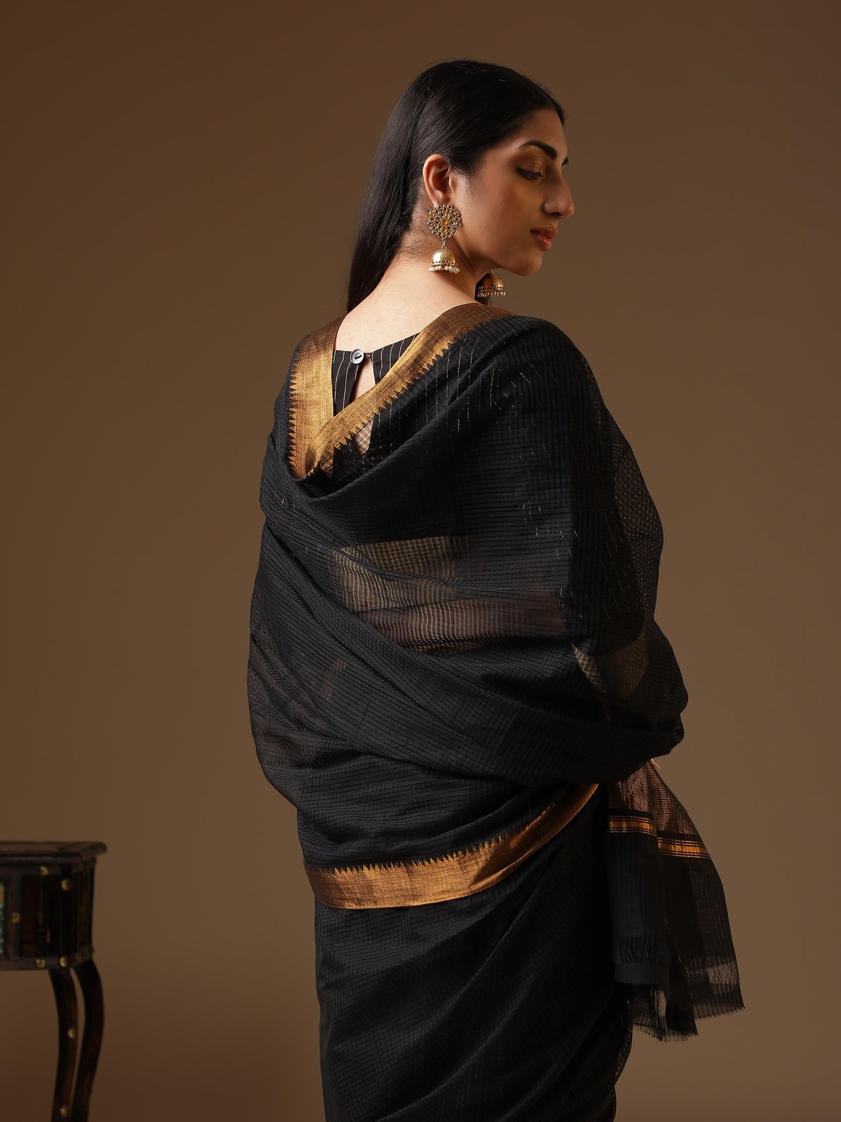 Close-up detail of black cotton blend Mangalgiri saree highlighting intricate weave and cotton blend finish.