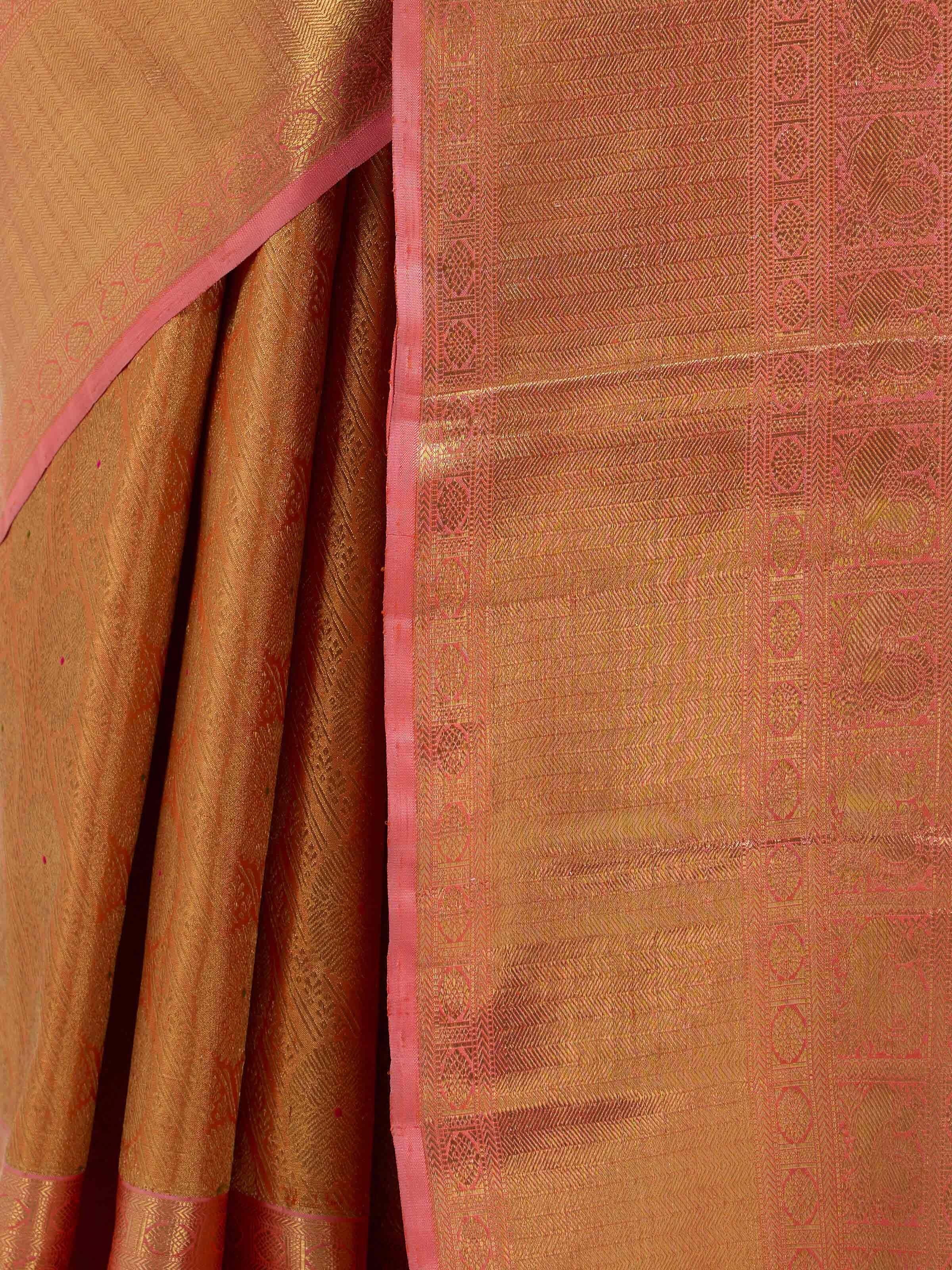 Detail view of yellow silk Kancheepuram saree showing silk texture and zari craftsmanship