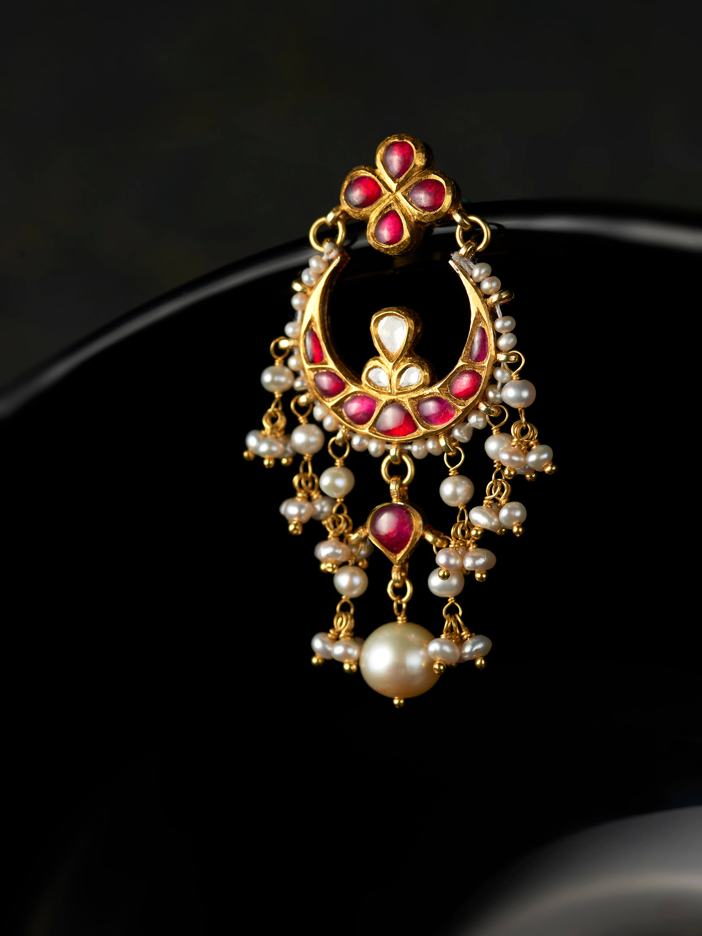 detail view of jadau 18 karat gold drops design