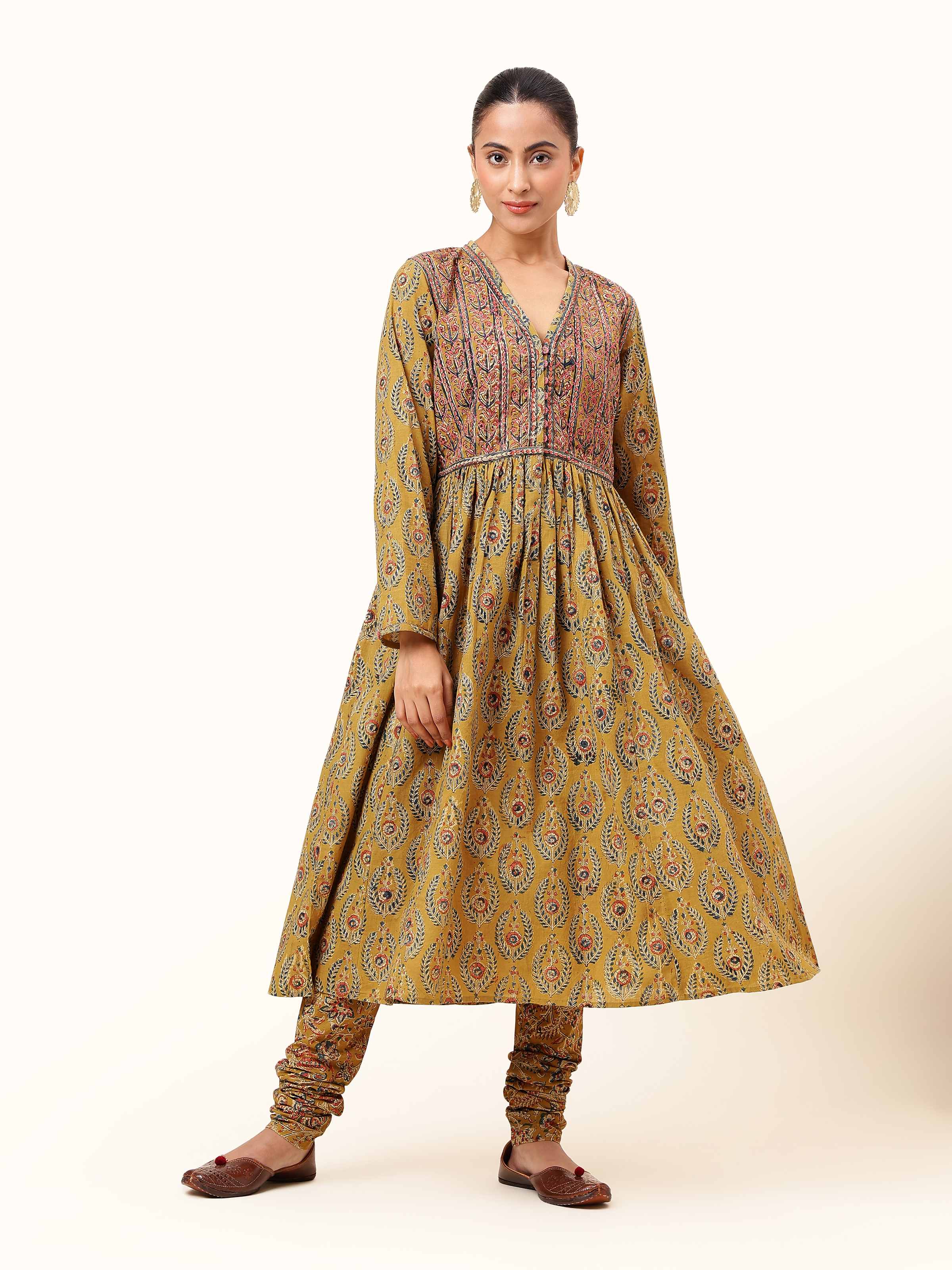 Front view of Yellow Cotton Kalamkari Block Printed Churidaar displaying vibrant block print on soft cotton fabric.