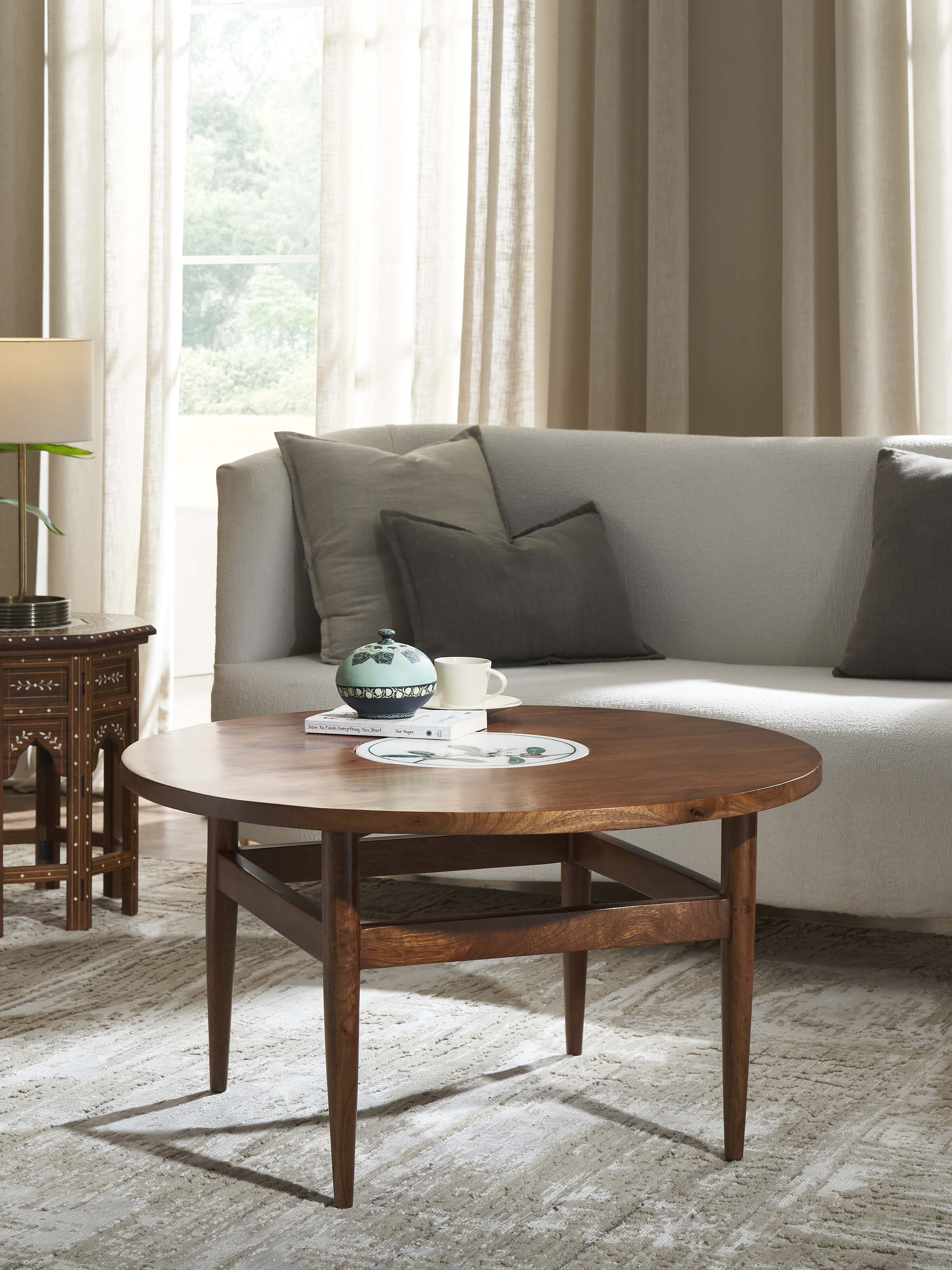 Lifestyle view of Pacchikari Marble Walnut Finish Round Coffee Table