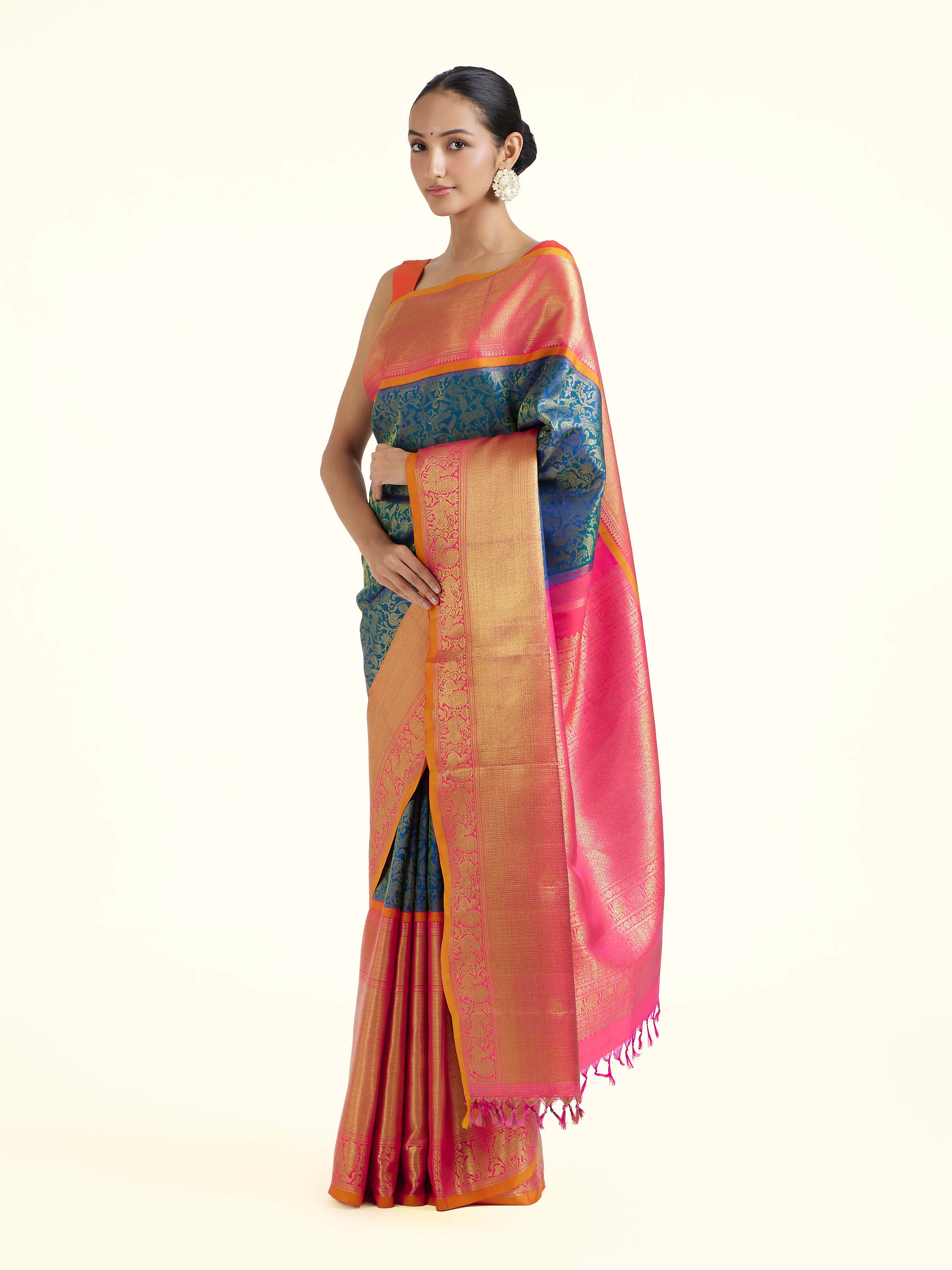 Side view of blue silk Kancheepuram saree with graceful drape and contrast border
