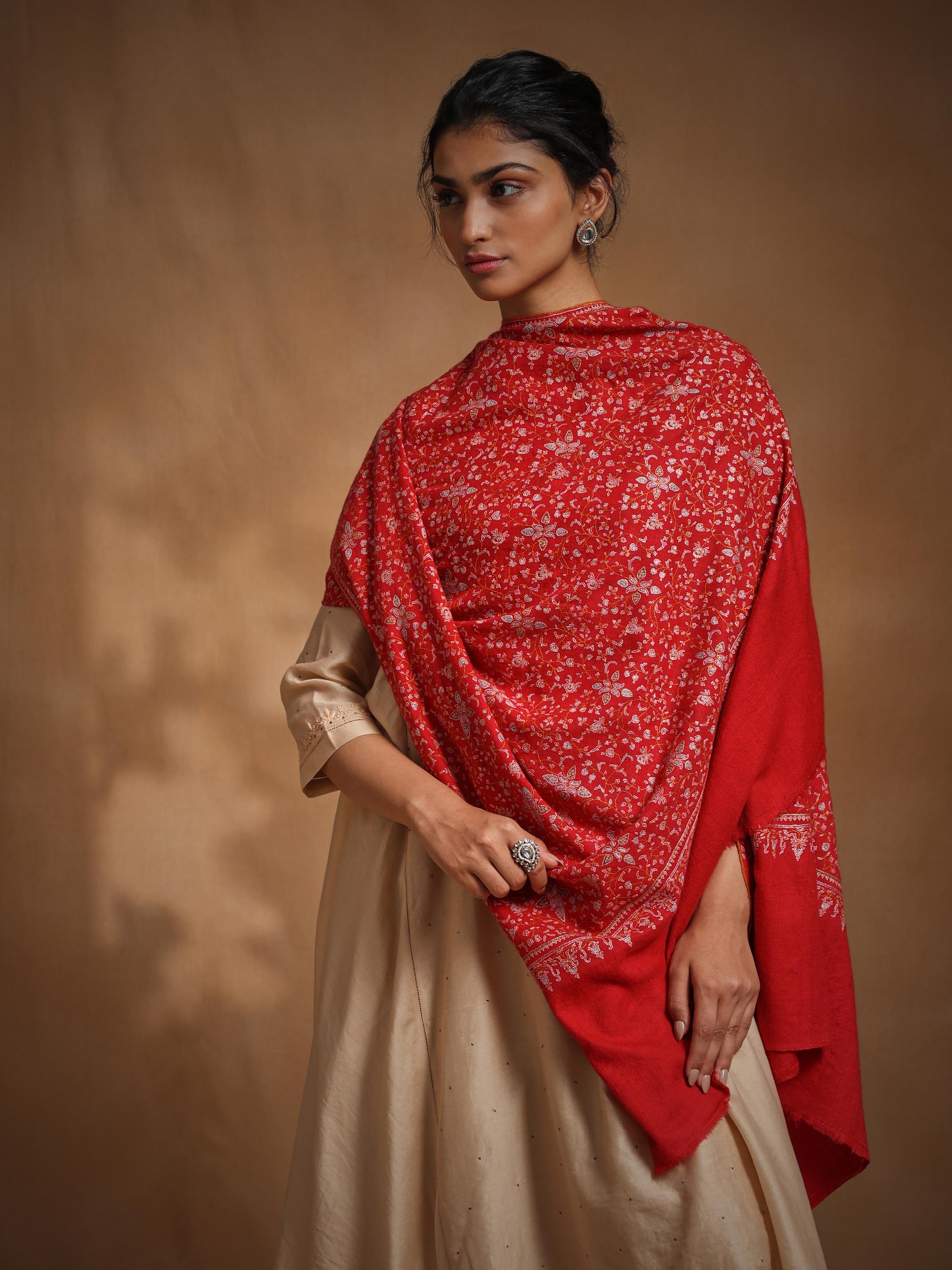 Side view of cashmere sozni embroidered shawl highlighting embroidery patterns