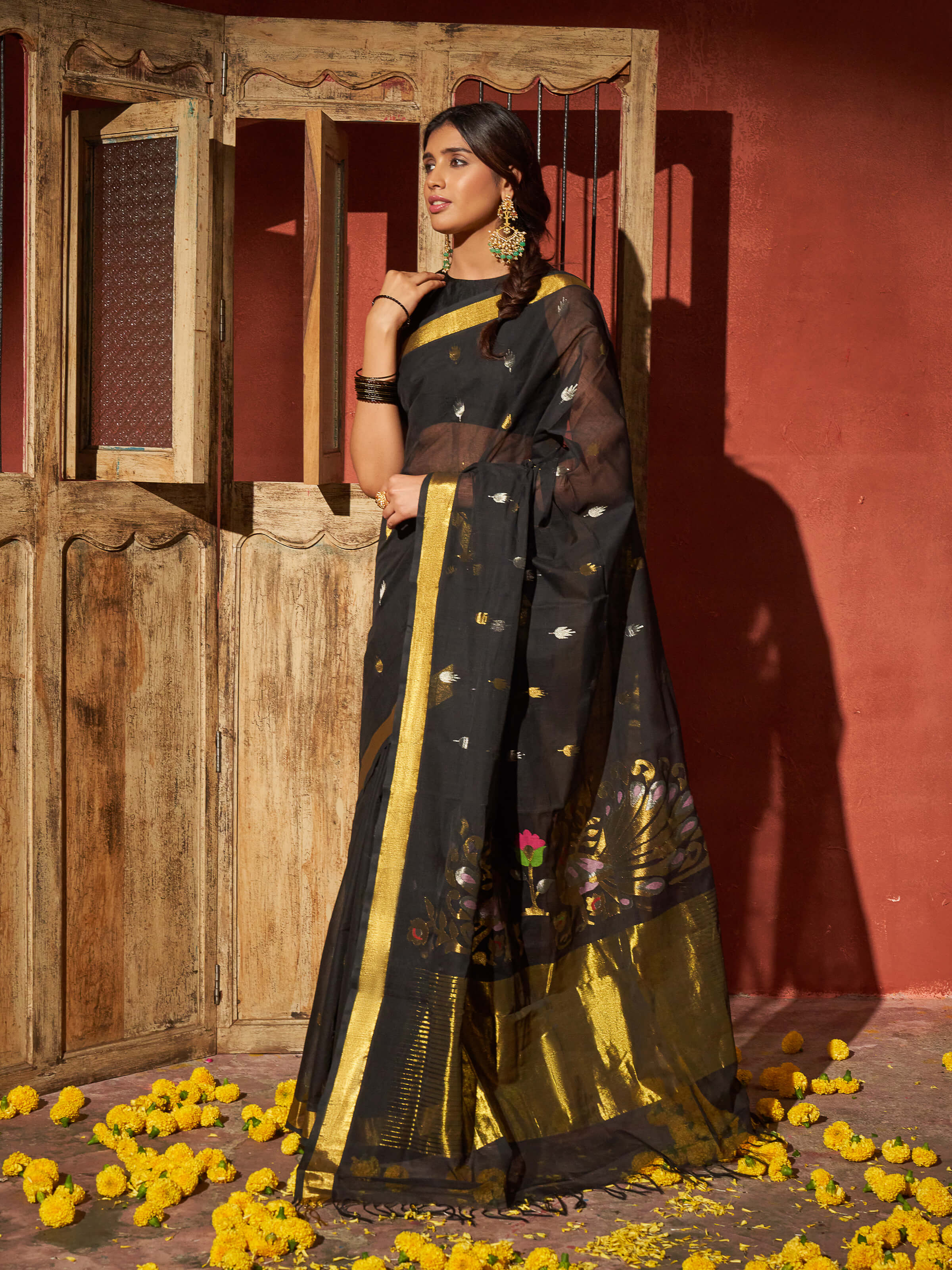 Side view of black cotton Venkatagiri saree with soft drape and subtle border