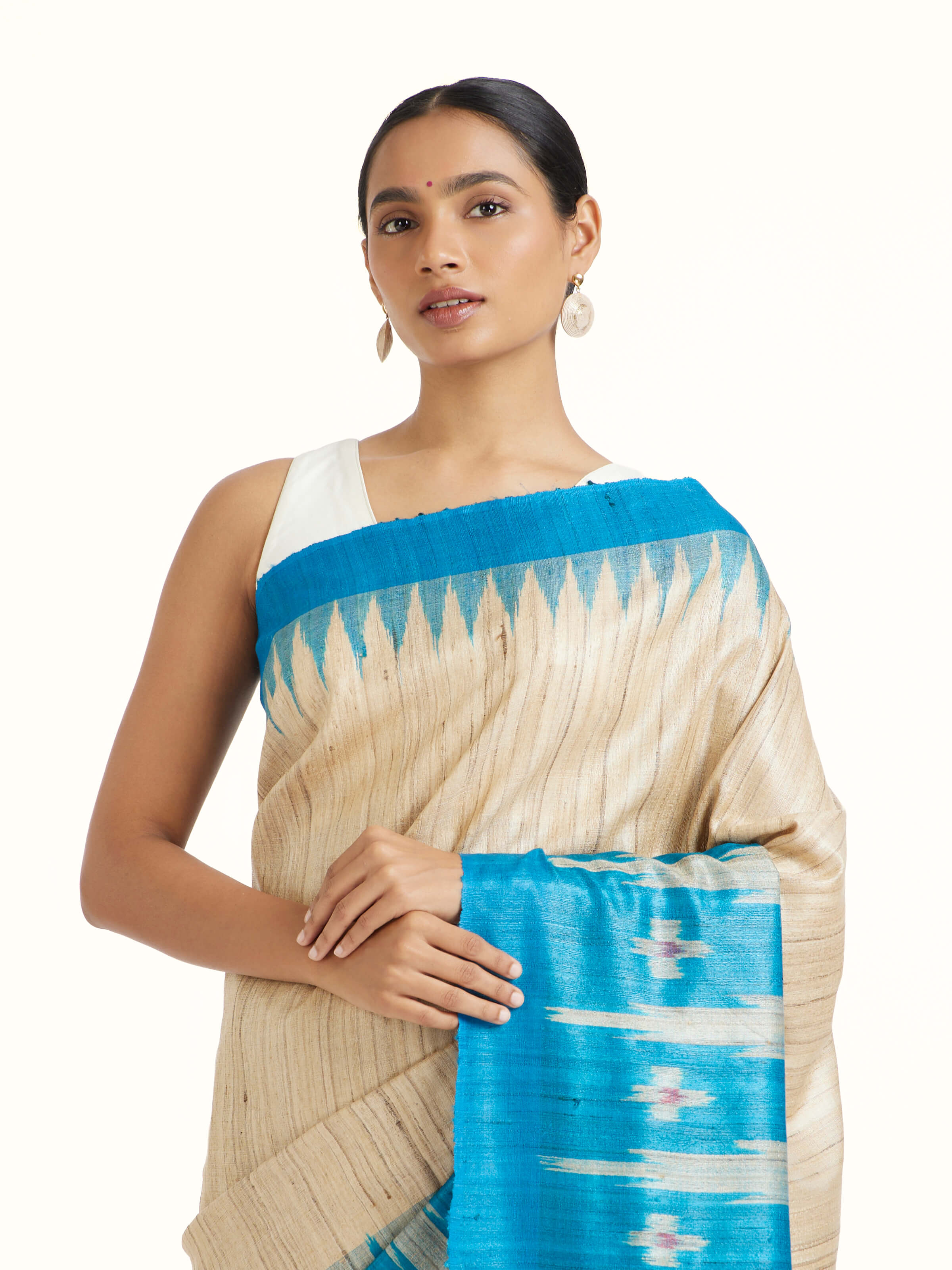 Angled view of the Turquoise Tussar Ghicha Silk Bandha Ikat Saree