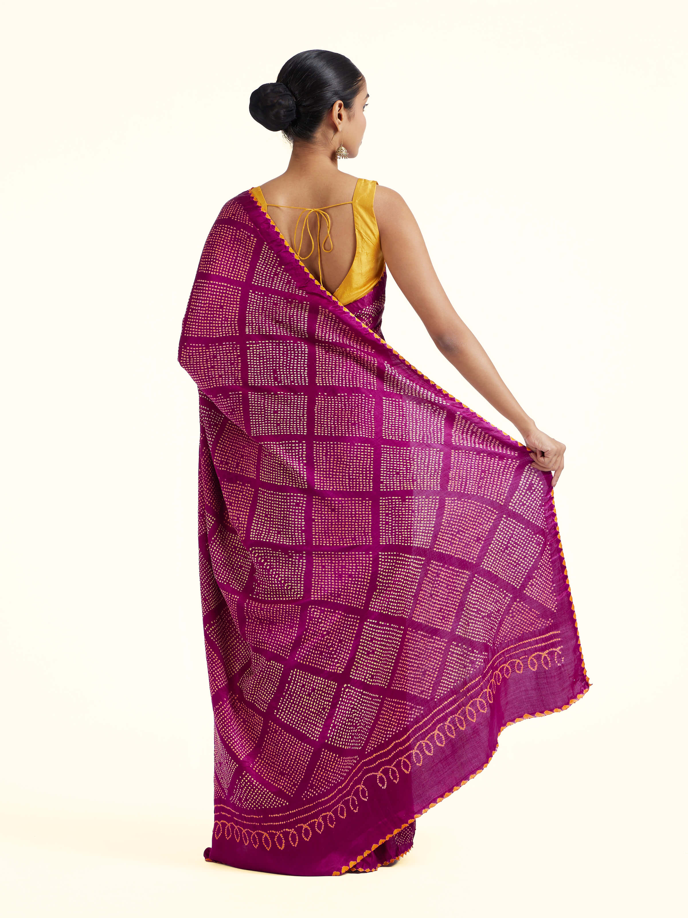 Back view of purple silk tie and dye Bandhani saree displaying overall design