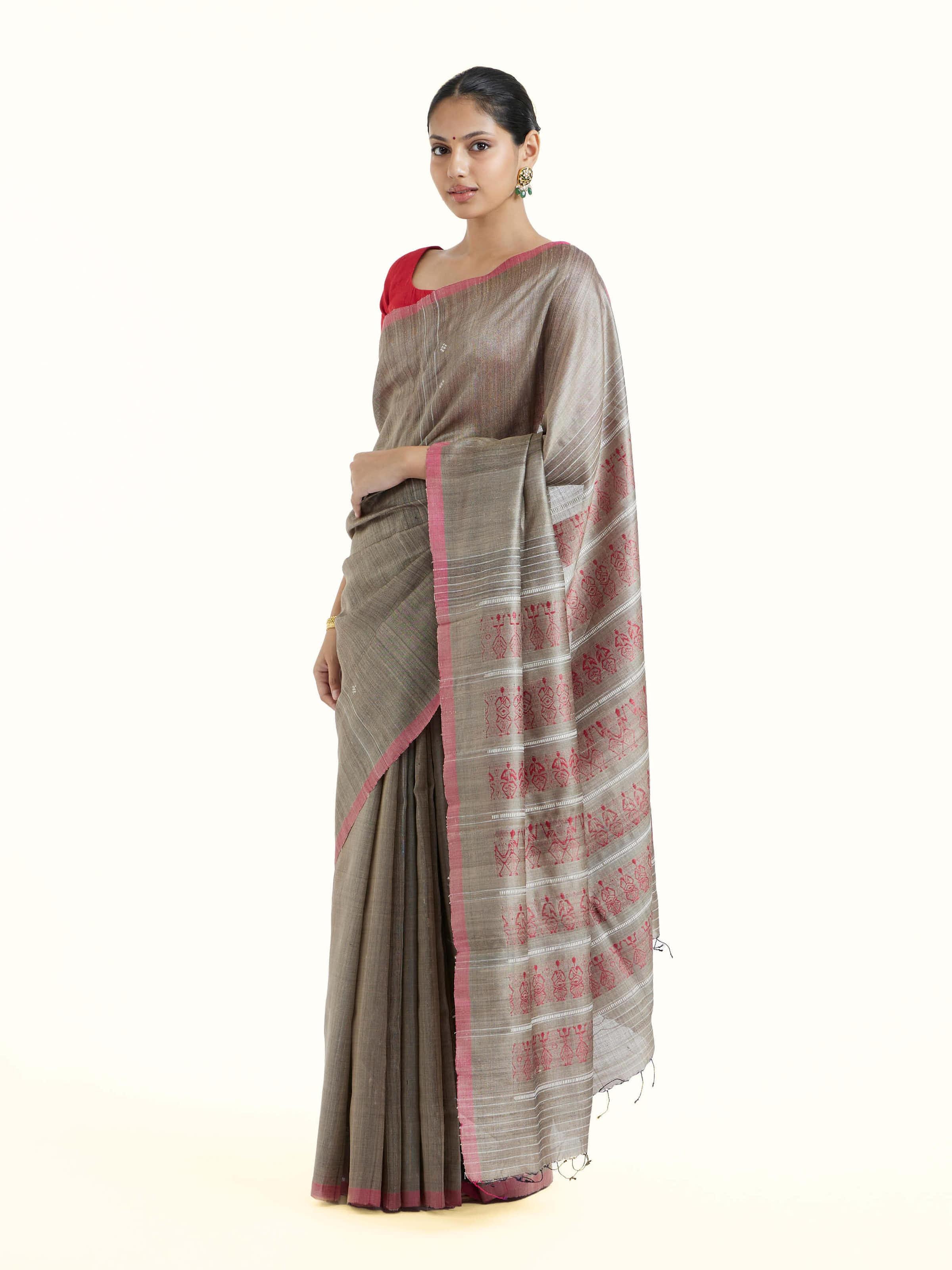 Side view of beige tussar silk Odisha ikat saree with graceful drape