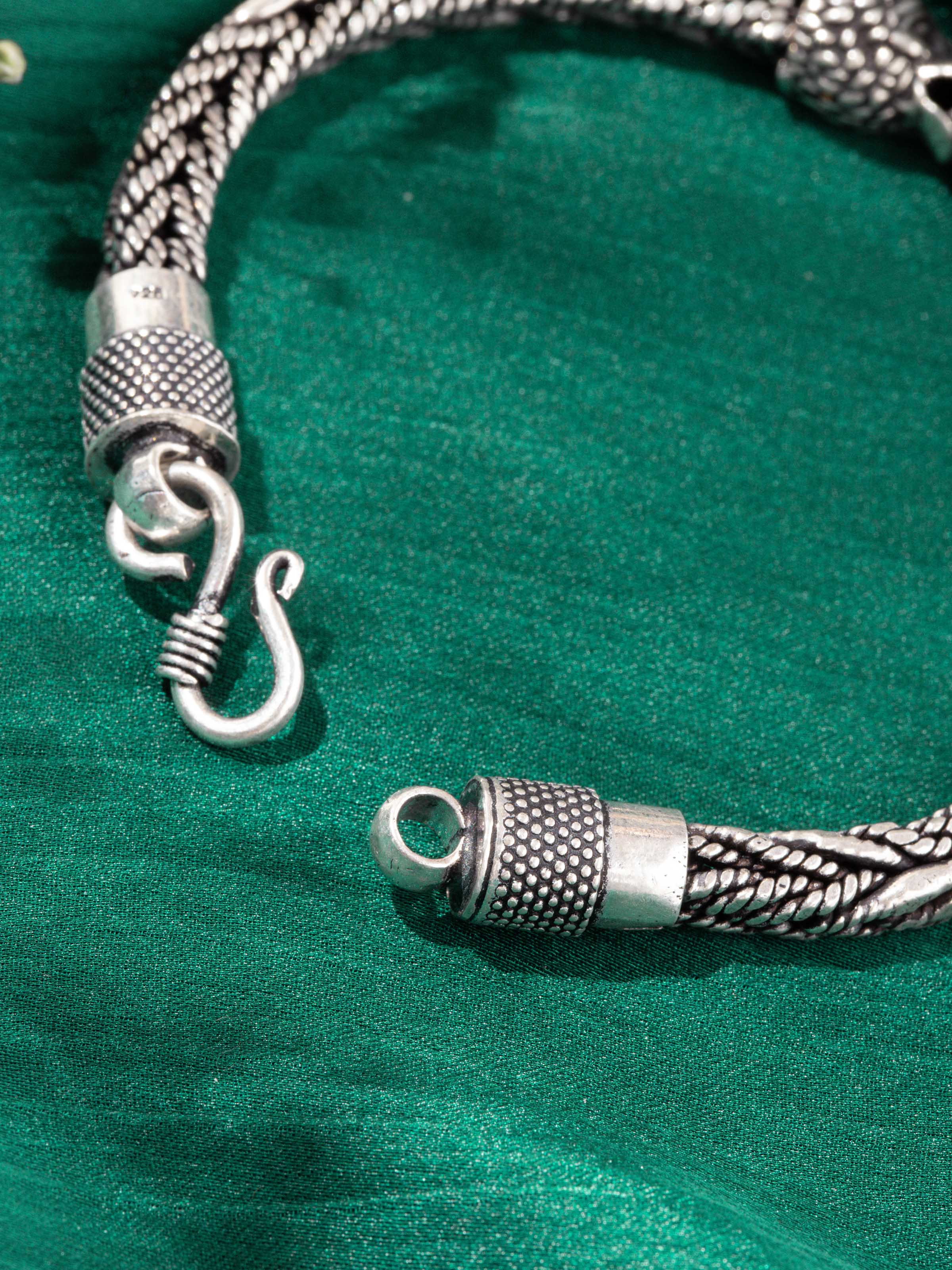 Close-up detail of silver flexi bracelet links and clasp showing smooth finish and clean handcrafted detailing.