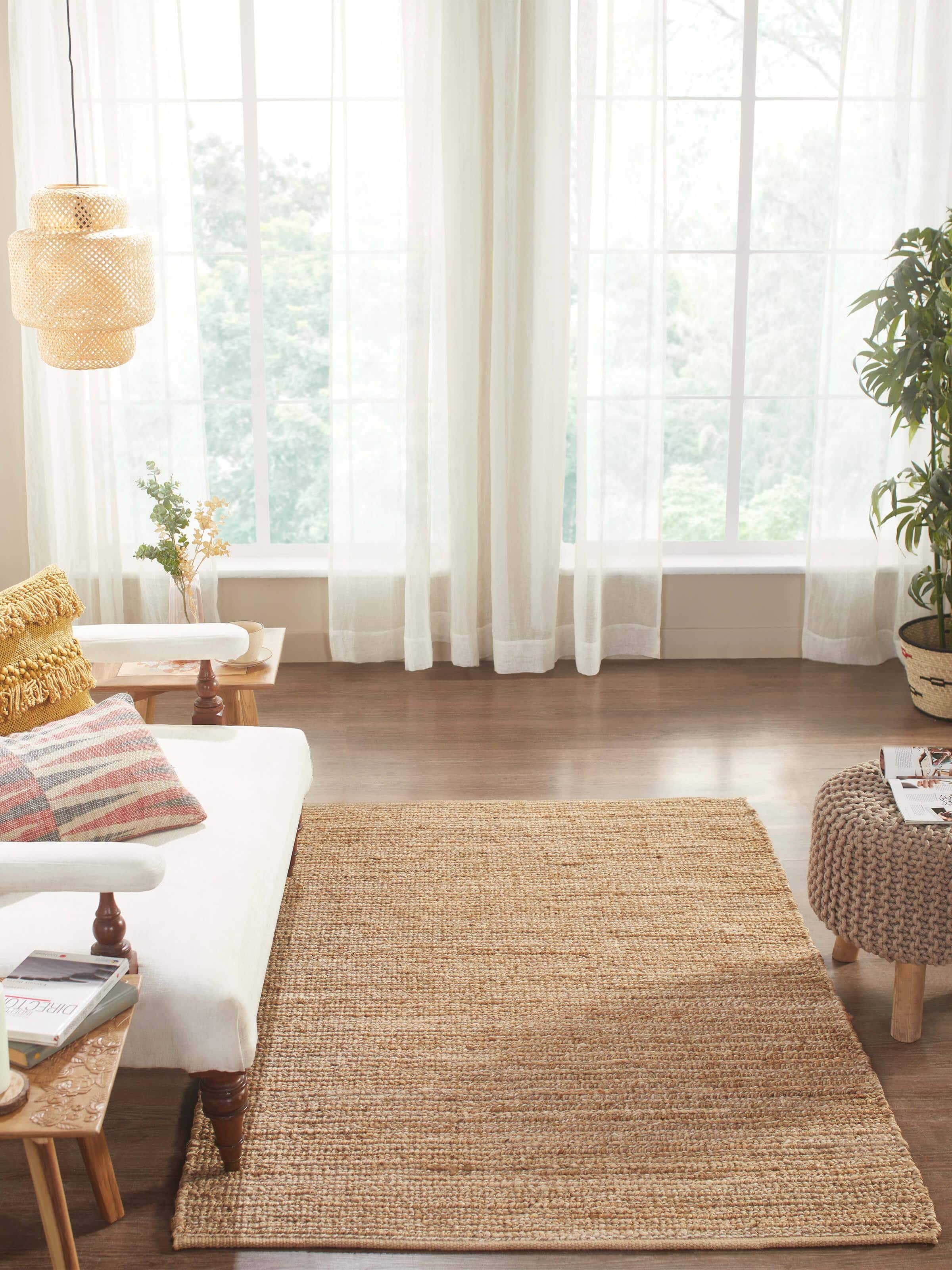 Top-down view highlighting the rug’s natural fibre texture and solid beige color