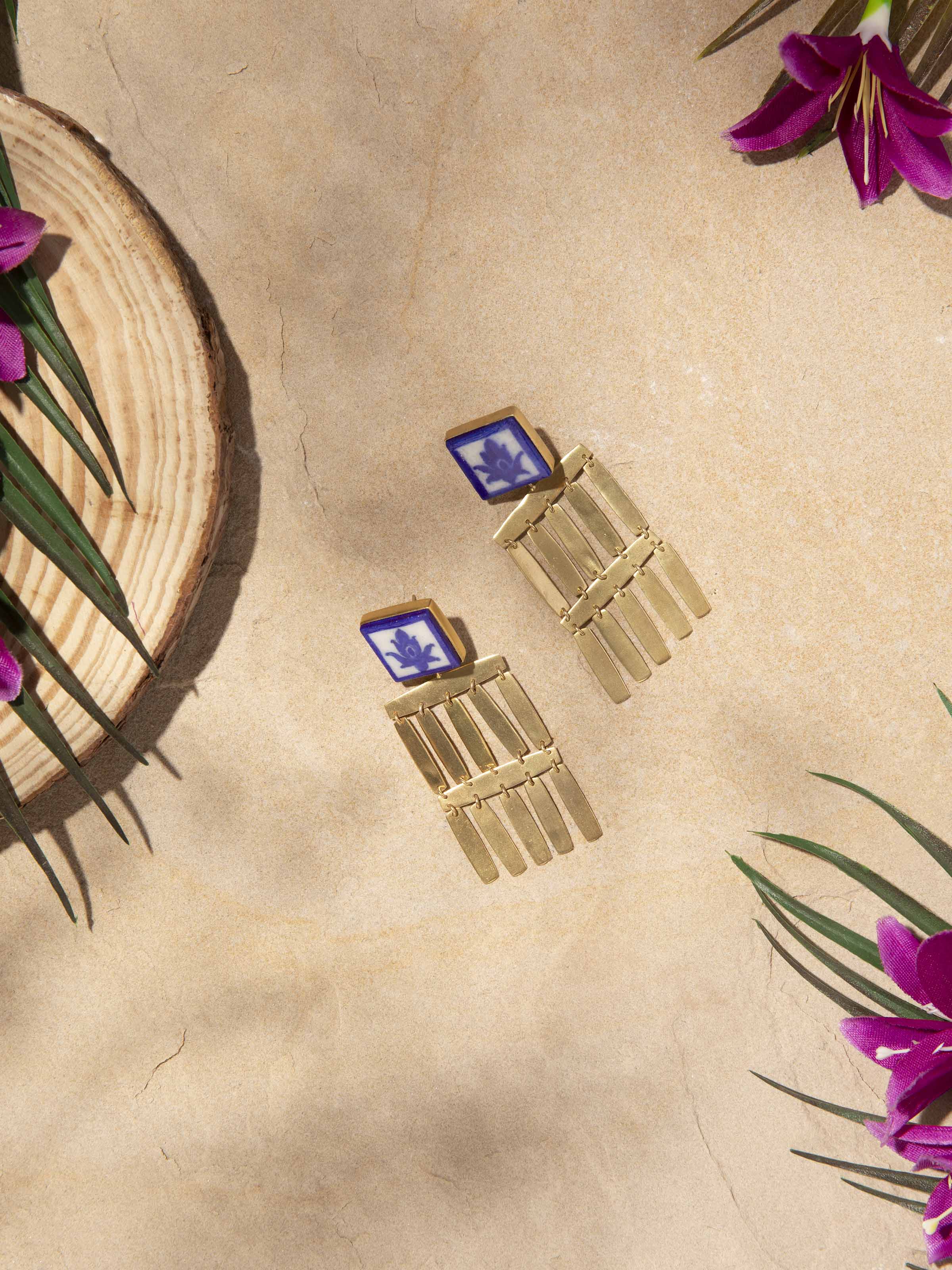 Side view of Blue Pottery Drop Earrings emphasizing the vibrant blue pottery and detailed design