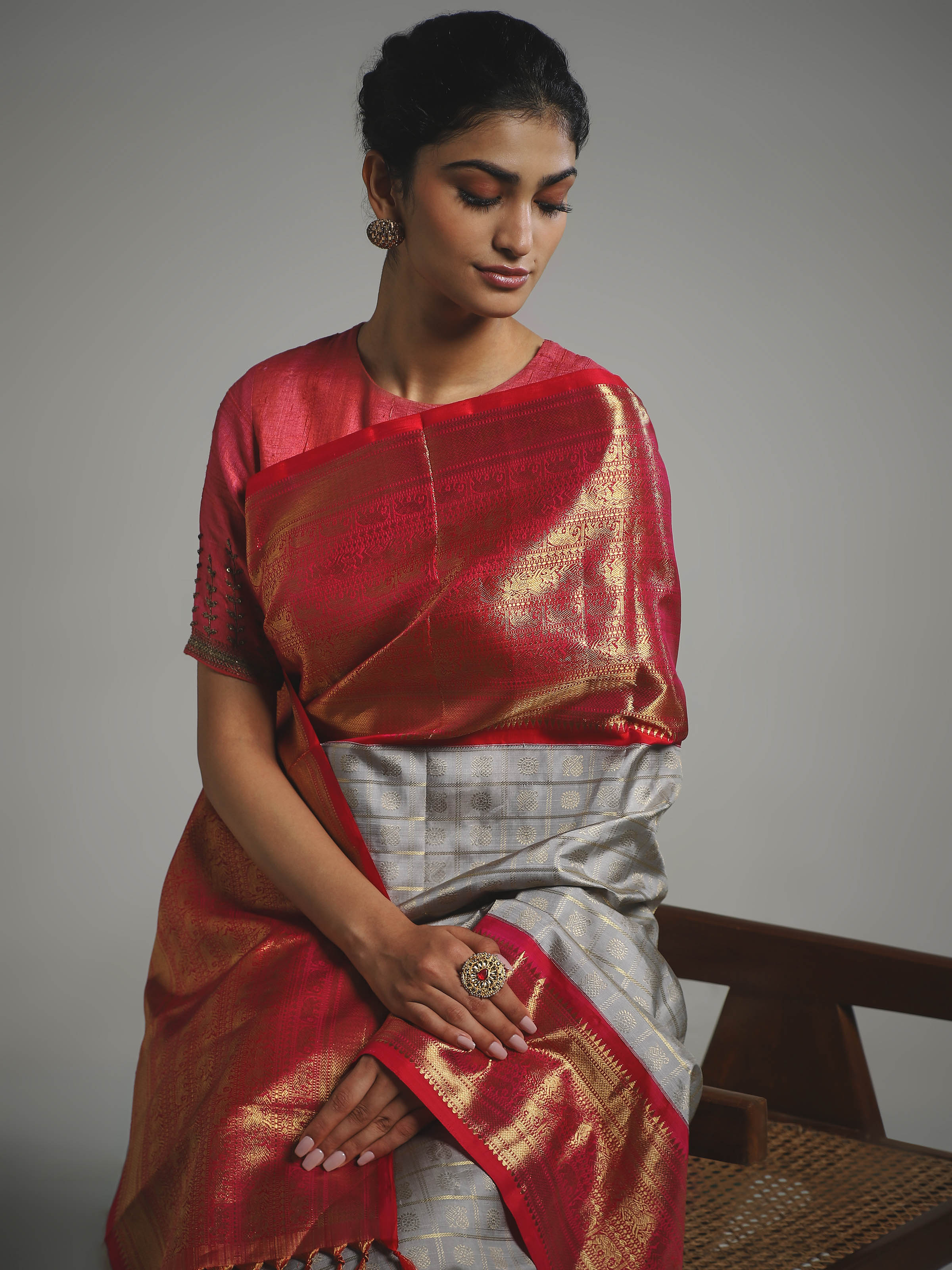 Angled view of grey silk Kancheepuram saree highlighting traditional weave
