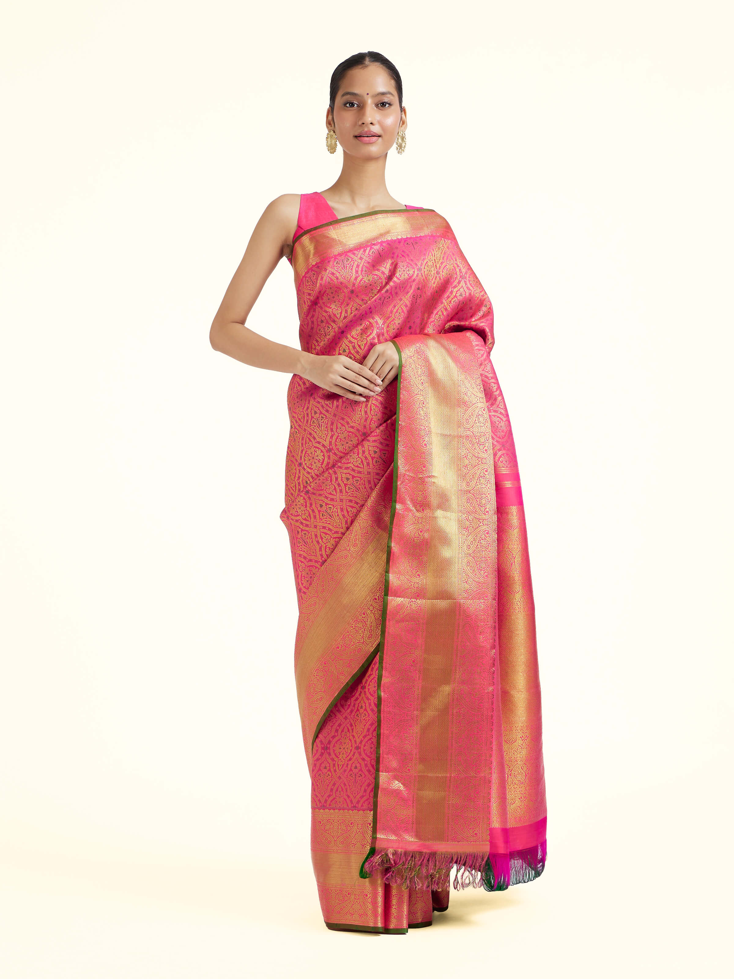 Front view of pink silk Kancheepuram saree with rich zari woven motifs