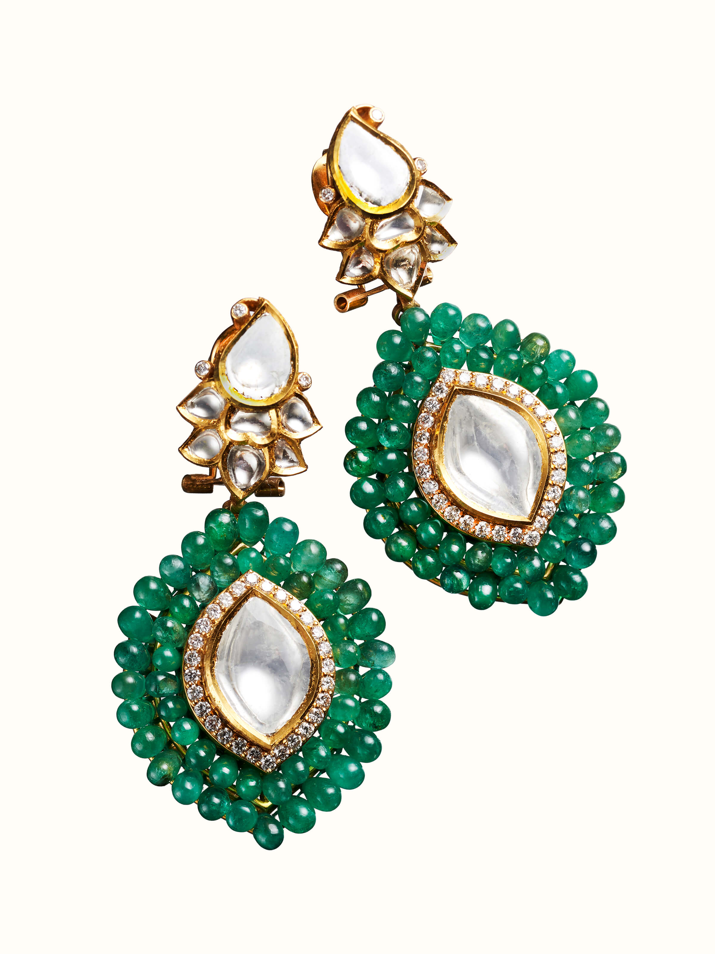 angled view of dank polki 14 karat gold drop earrings