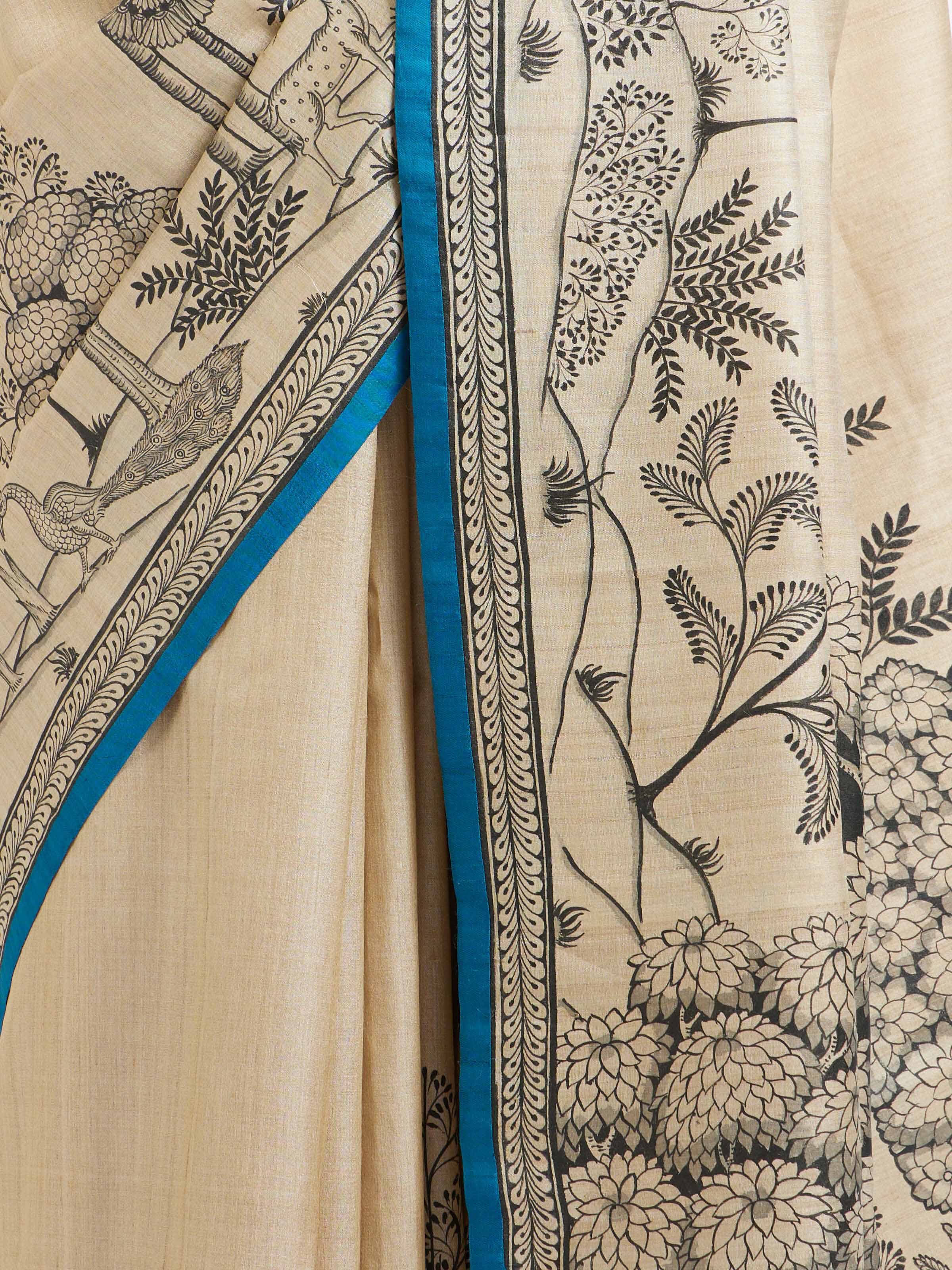 Detail view of tussar silk Pattachitra saree showing silk texture and painting