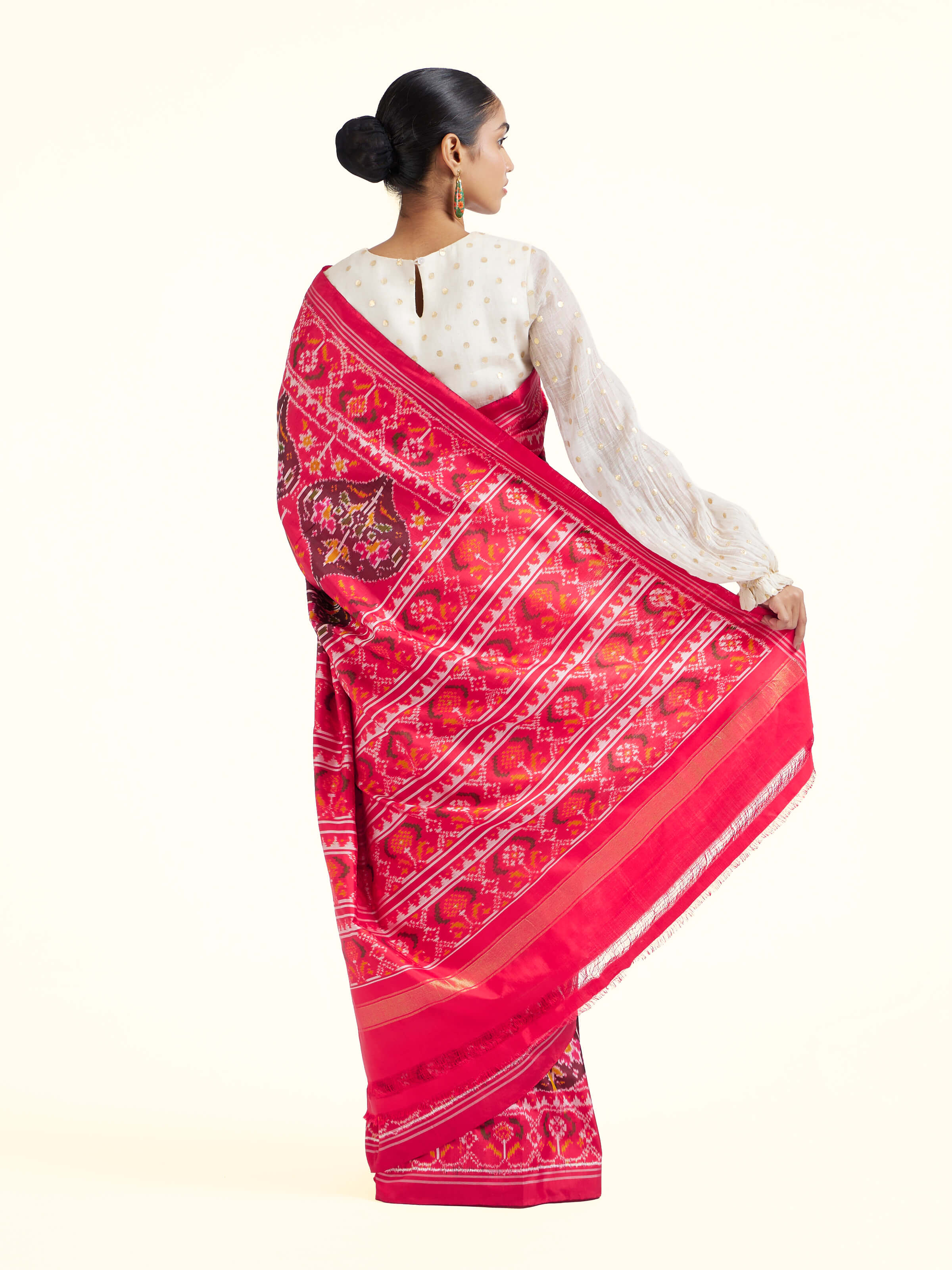 Back view of red mulberry silk Ikat saree displaying pallu design