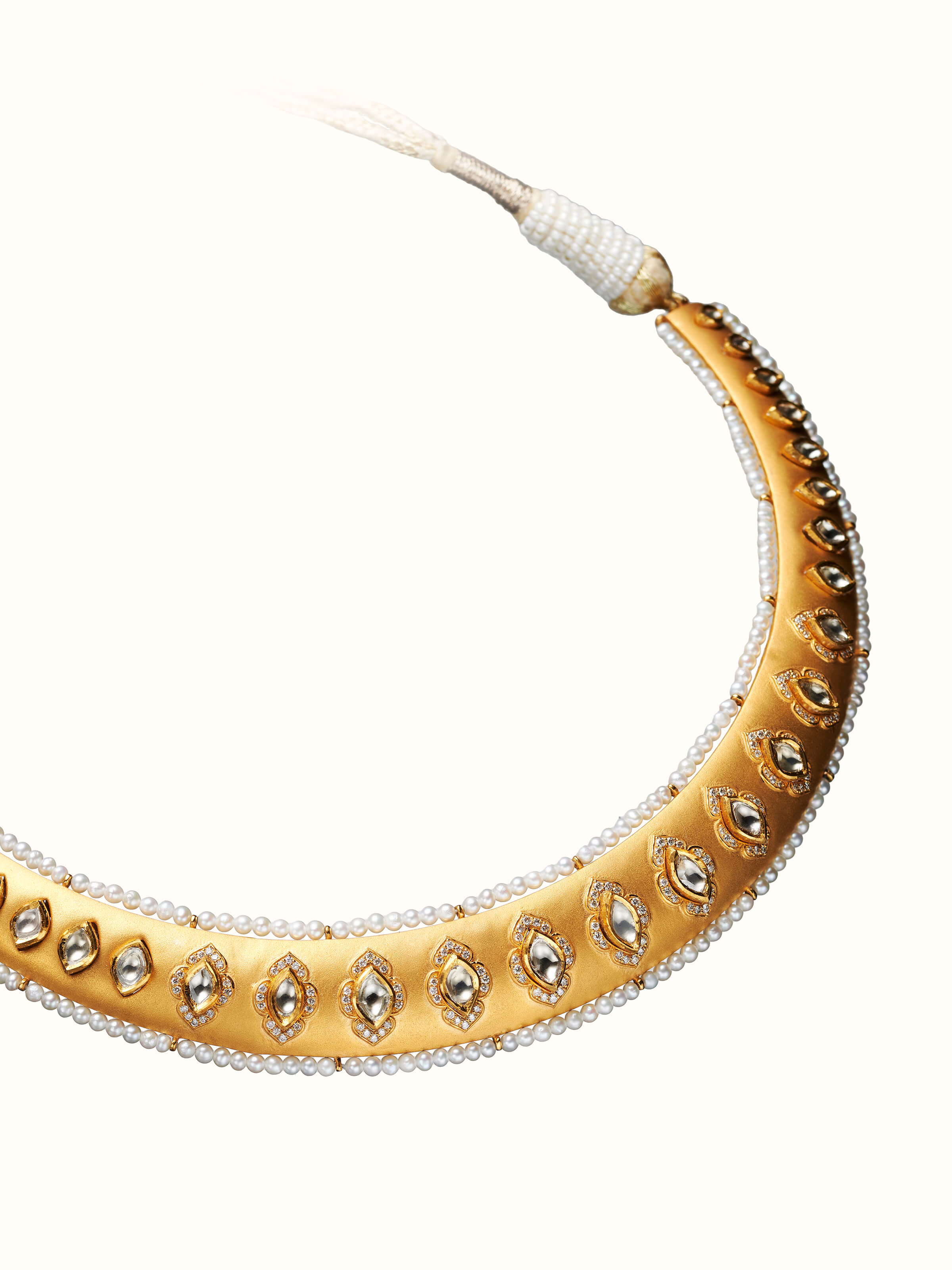 angled view of dank polki 14 karat gold collar necklace