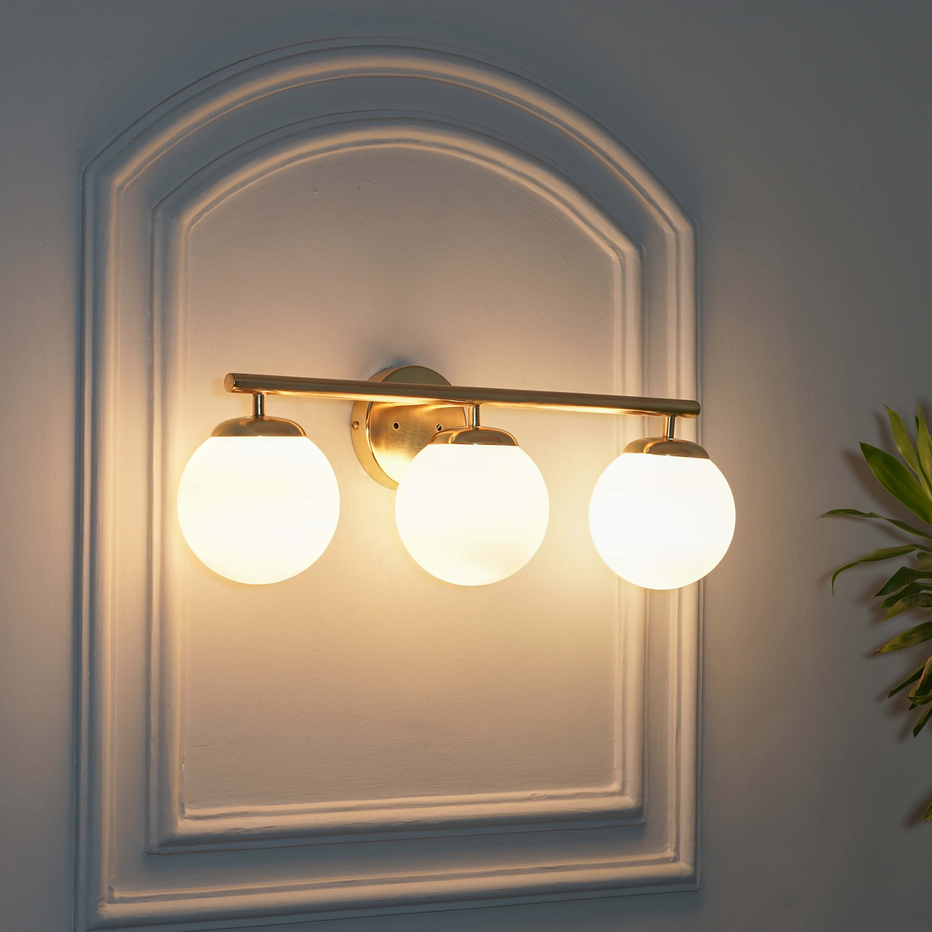 Hollis 3 Light Bathroom Wall Light with Opal Glass In Brass Finish