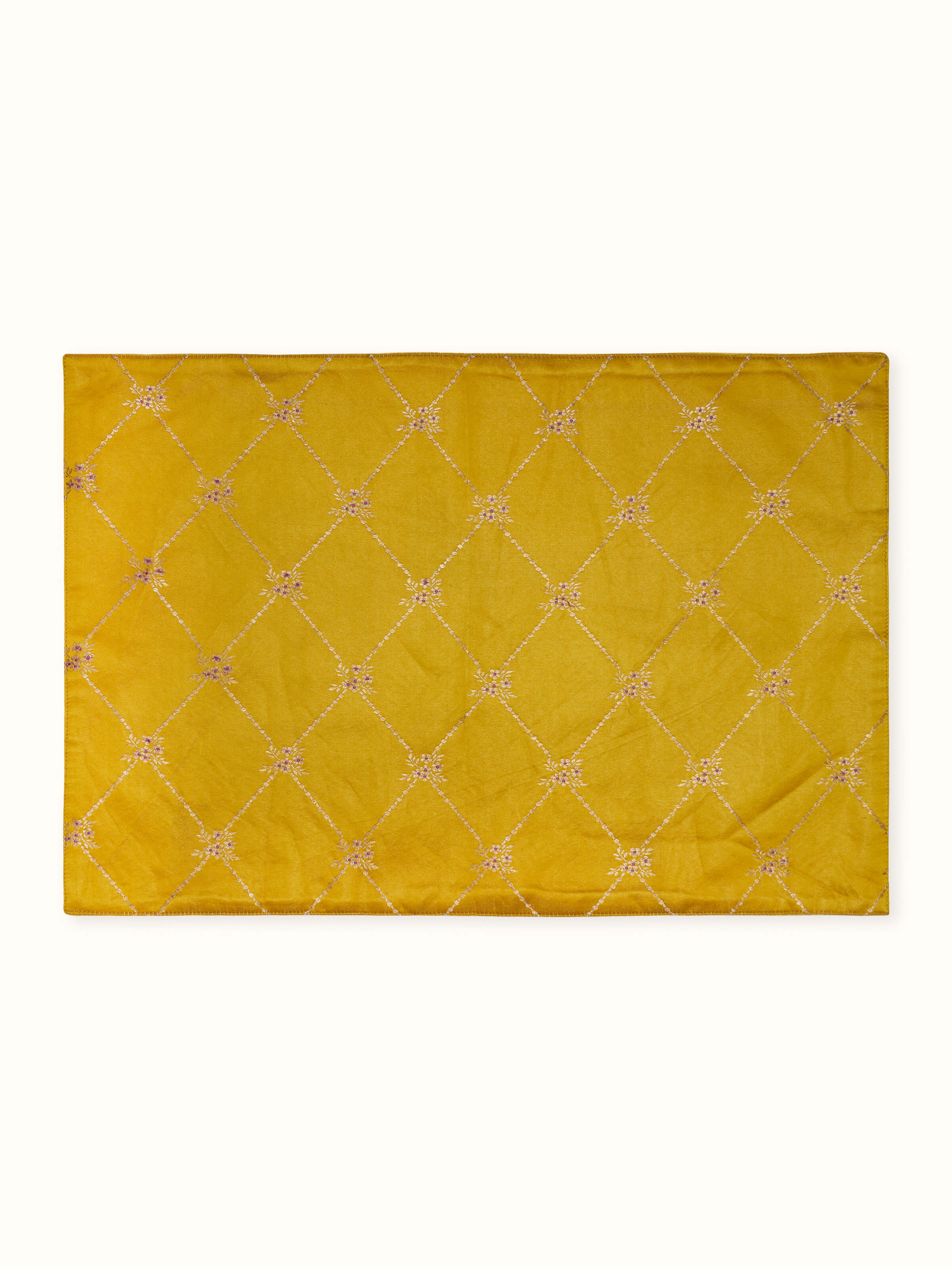 Front view of Mandana yellow silk Banarasi handloom table mats set of 6 showcasing trellis brocade pattern