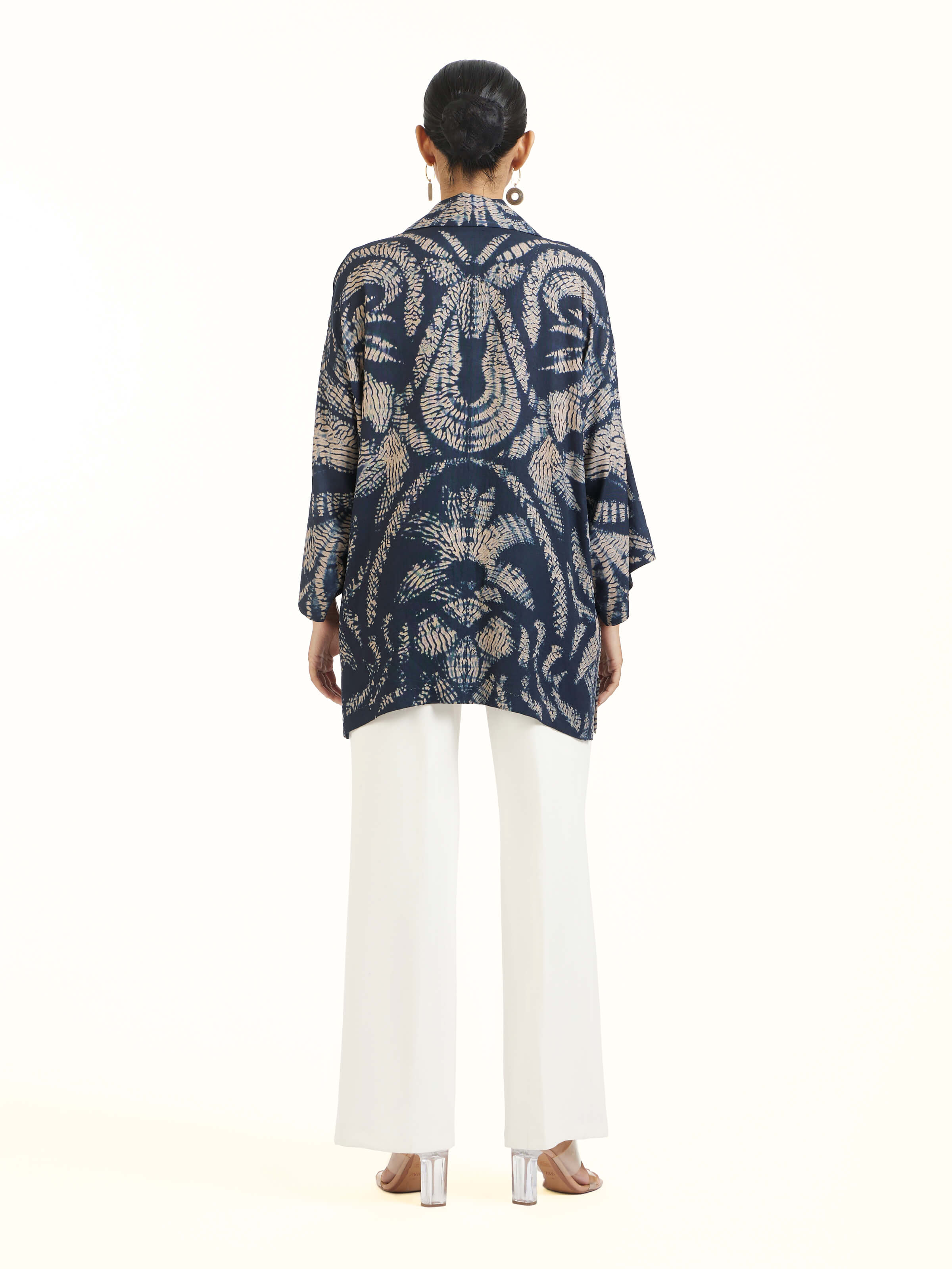 Back view of blue modal shibori shirt displaying pattern continuity and clean finishing