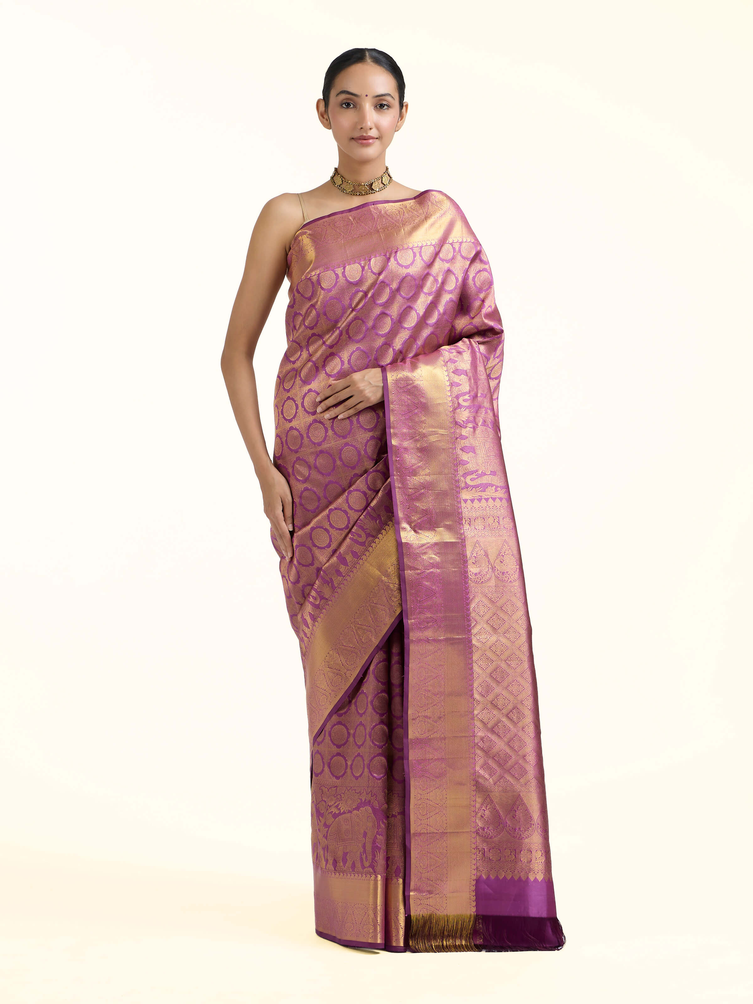 Front view of purple silk Kancheepuram saree with rich zari border