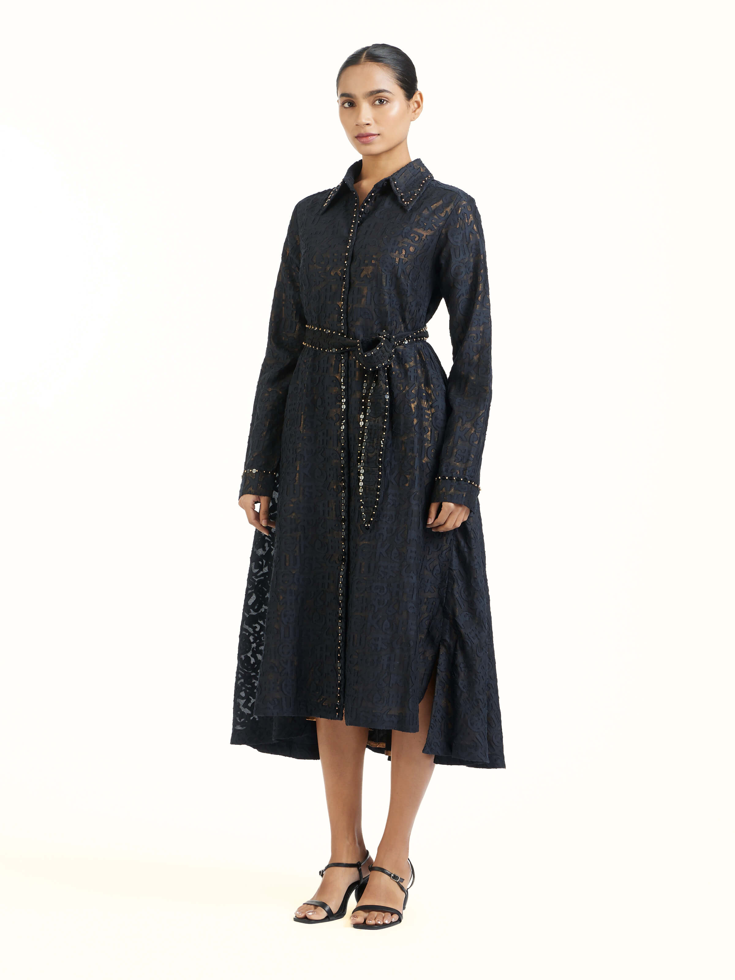 Side view of black handloom cut work dress highlighting elegant silhouette