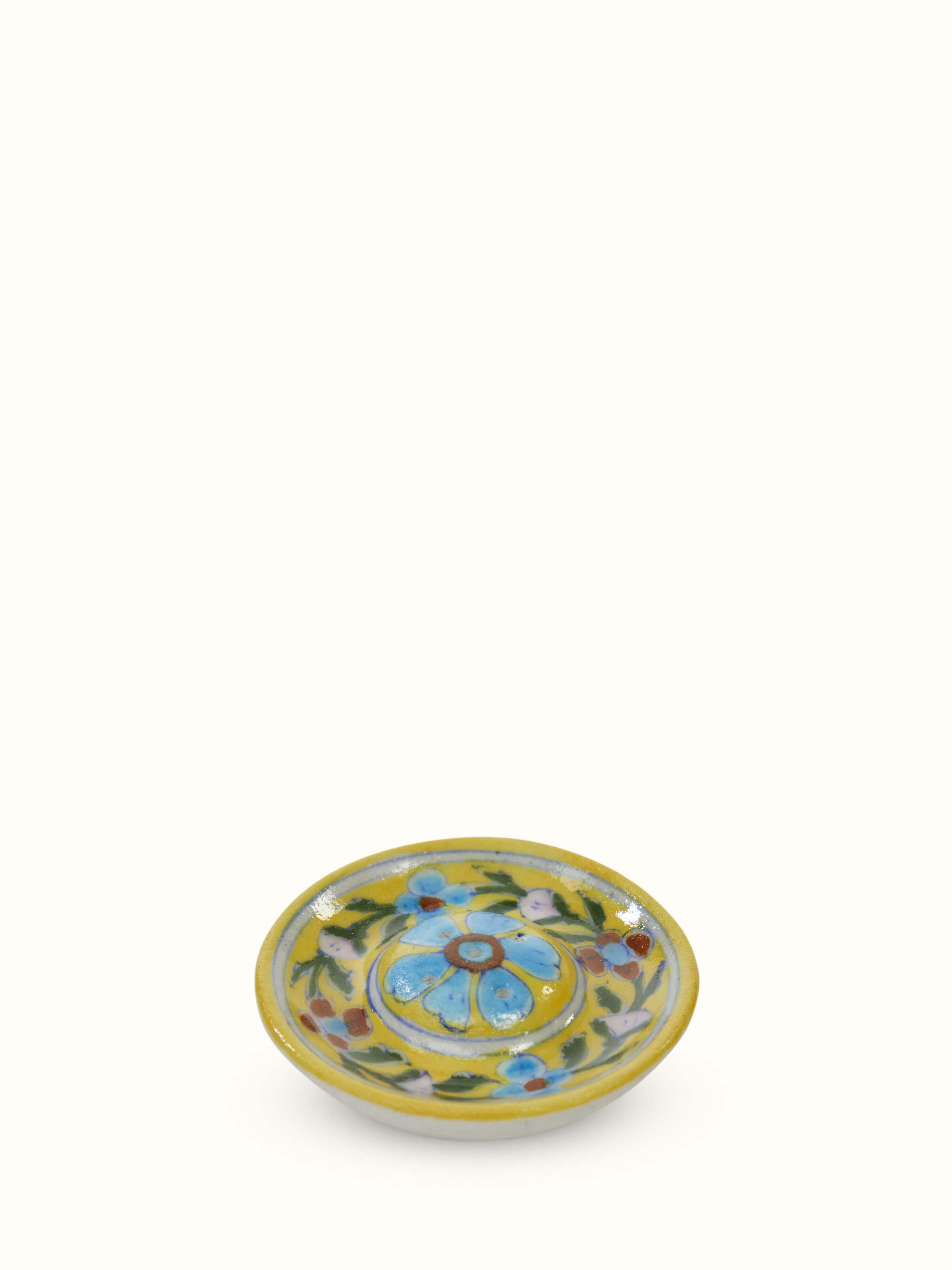 Top view of yellow blue pottery ceramic incense stick holder