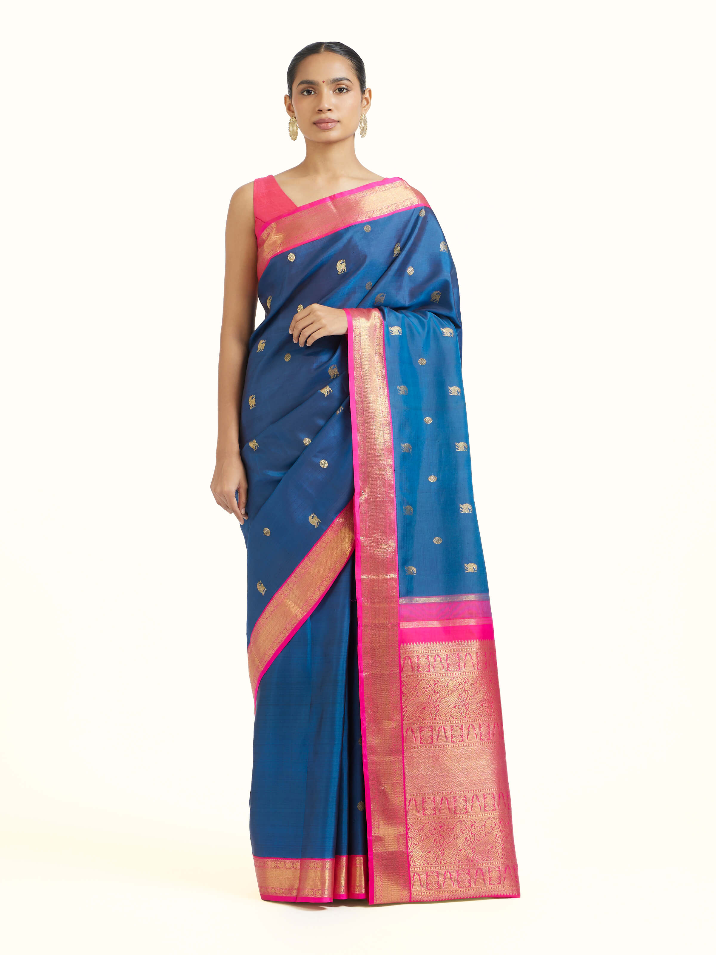 Front view of dark blue silk Kancheepuram saree with rich zari woven motifs
