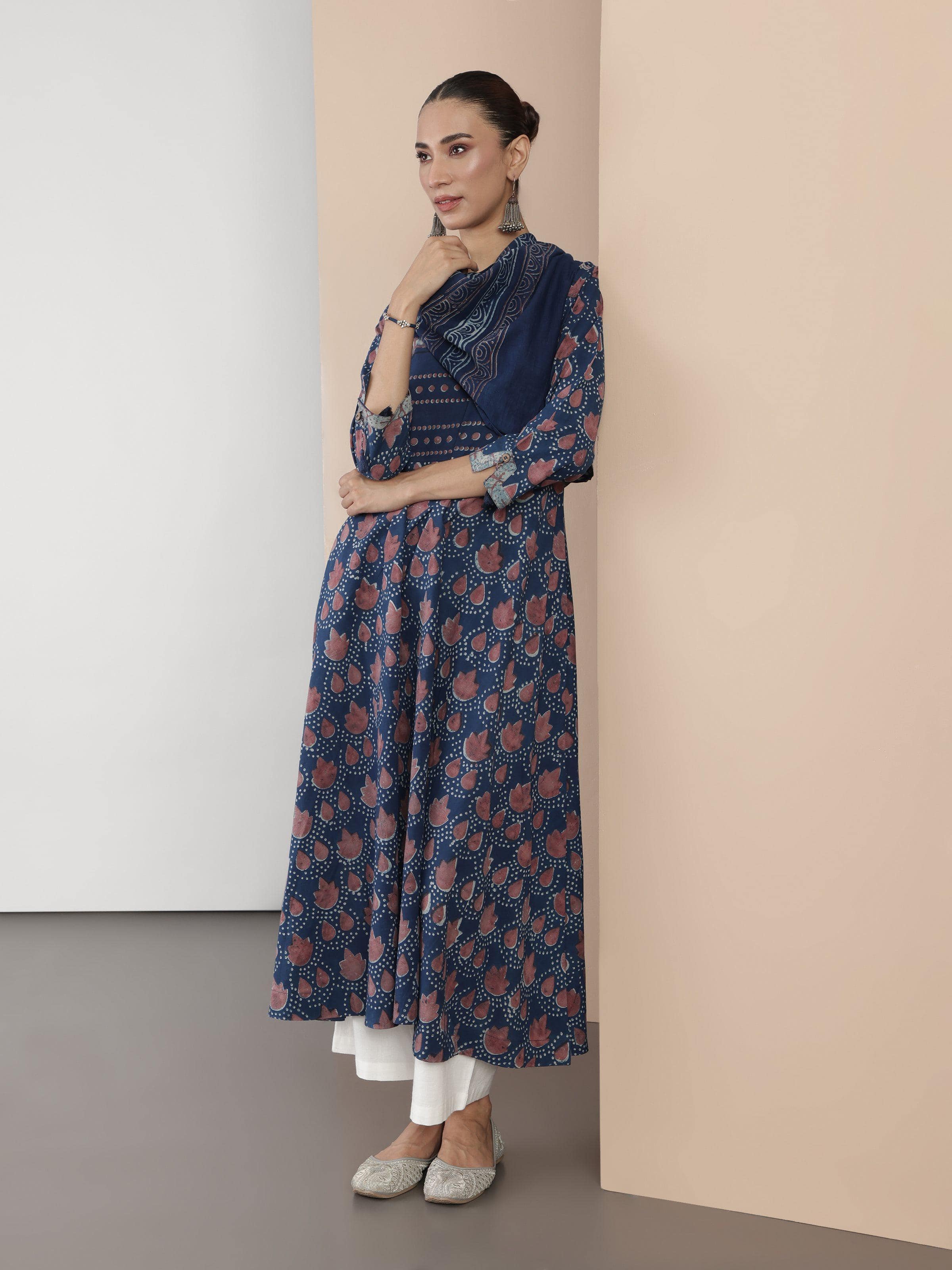 Lifestyle shot of blue cotton Dabu block print A-line kurta styled casually.