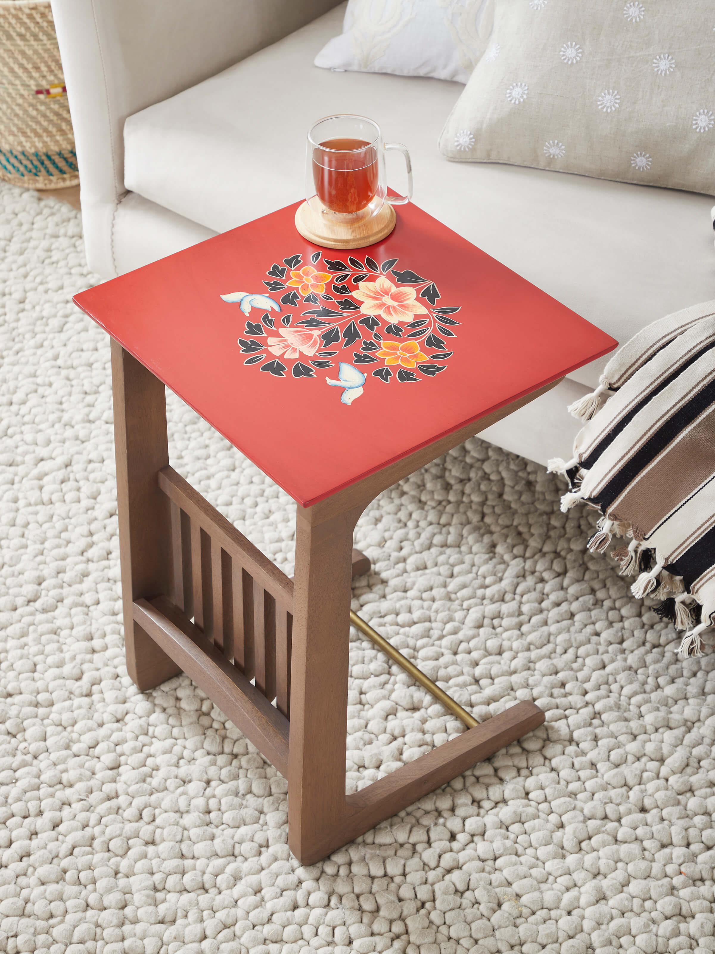 Side view of the mango wood table with miniature painting and a shelf